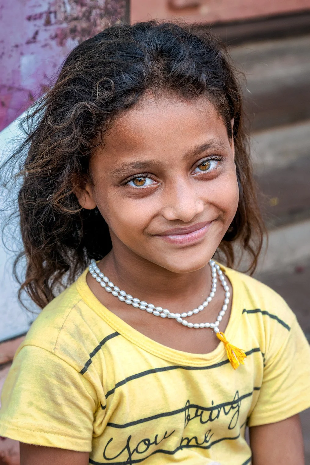 Portrait of a child in Varanasi captured in natural street light.