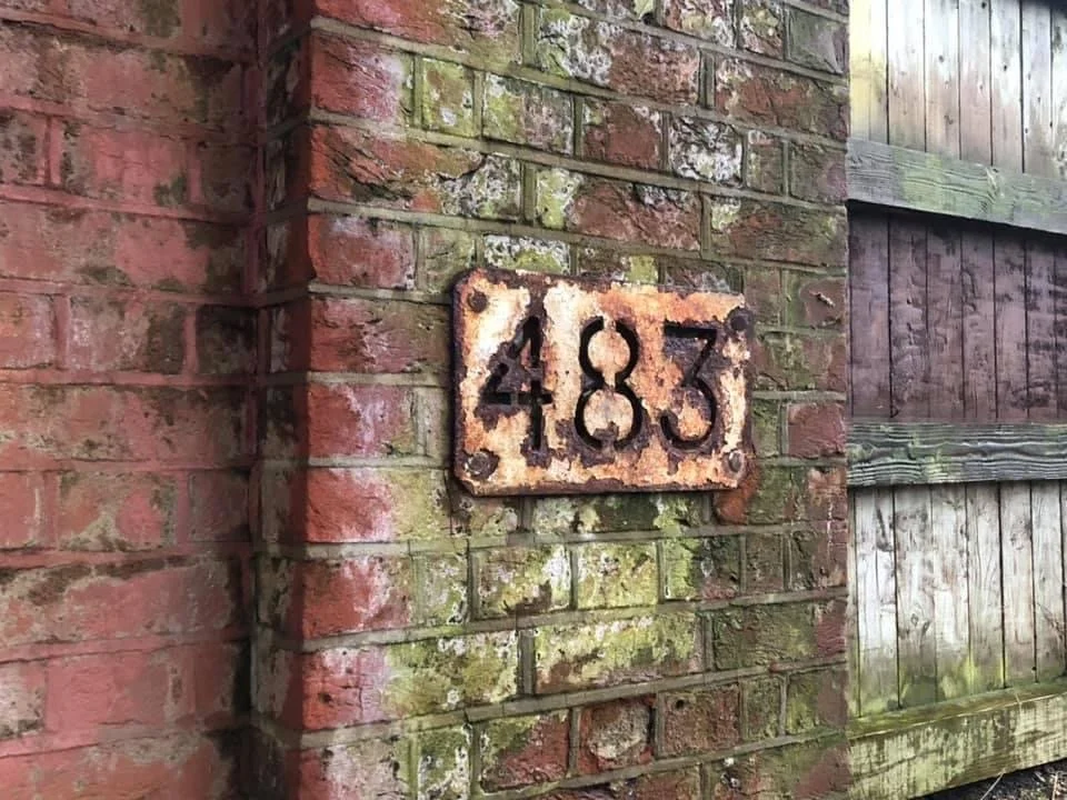 Photograph of a Rusty Sign