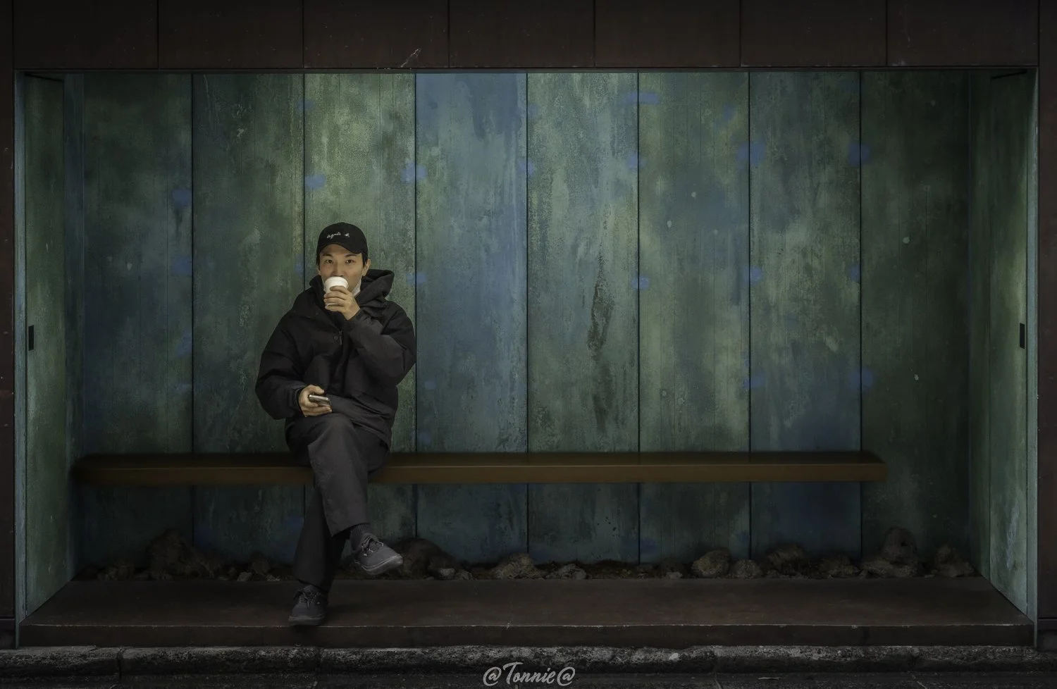 Kyoto man in bushokje squarespace.jpg