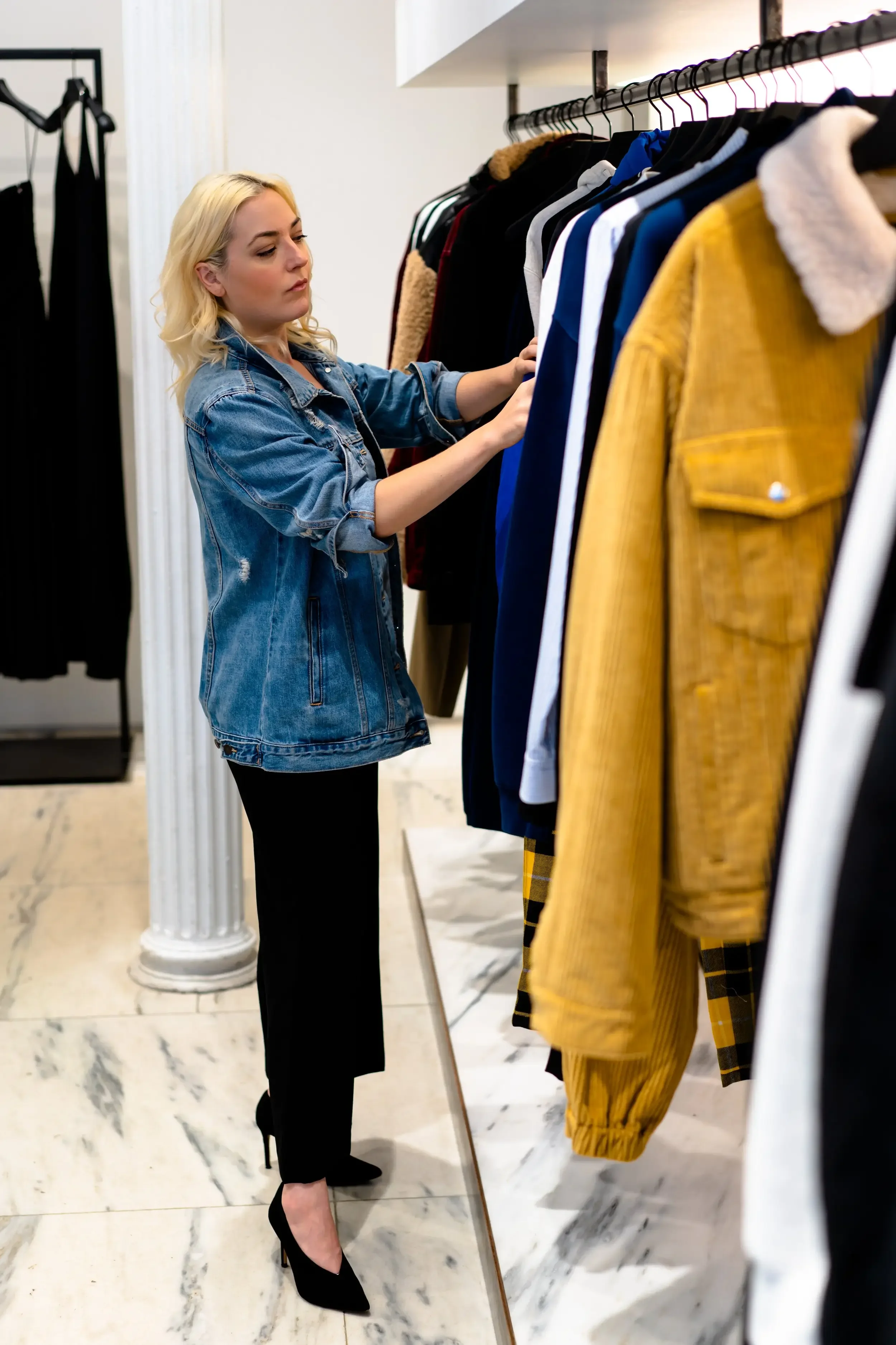 browsing through clothes on clothes rack, how to know how much to spend on shopping