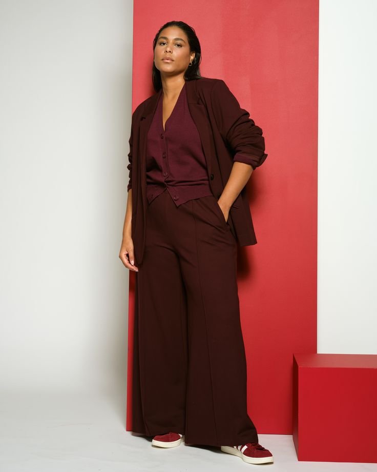 woman wearing burgundy  blazer and office pants
