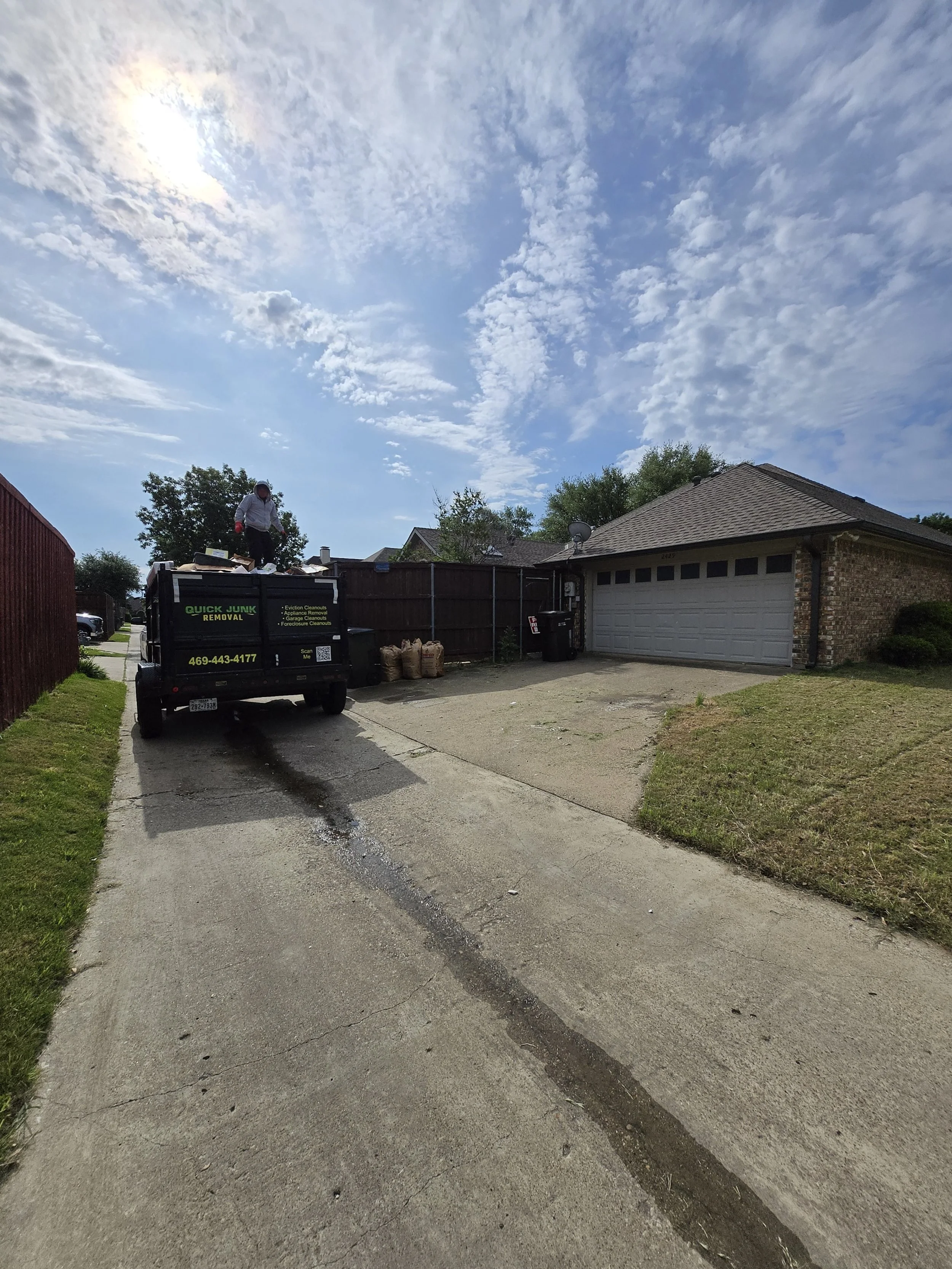 Bulk junk removal after loading – driveway cleared after junk hauling in Plano TX