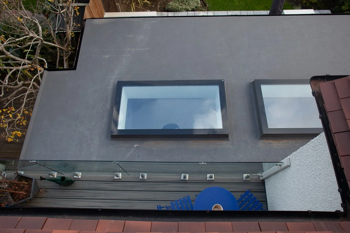 Rear roof conversion with dormer structure and multiple rooflights