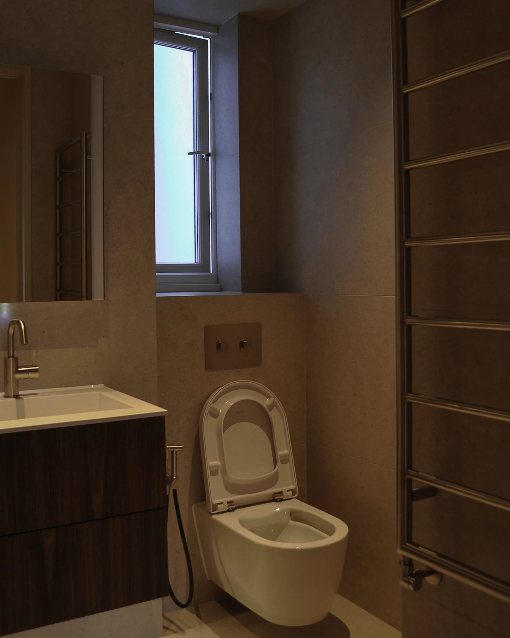 Completed Chelsea bathroom renovation with wall-hung sanitaryware and stone-effect finishes