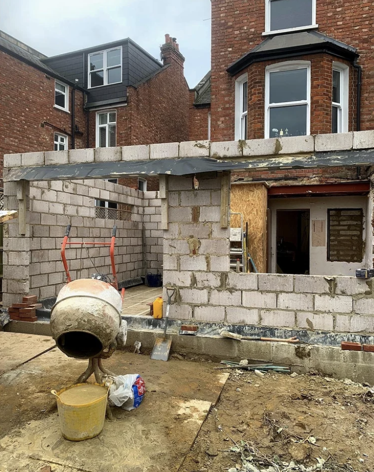 Home extension under construction in London showing new blockwork structure.