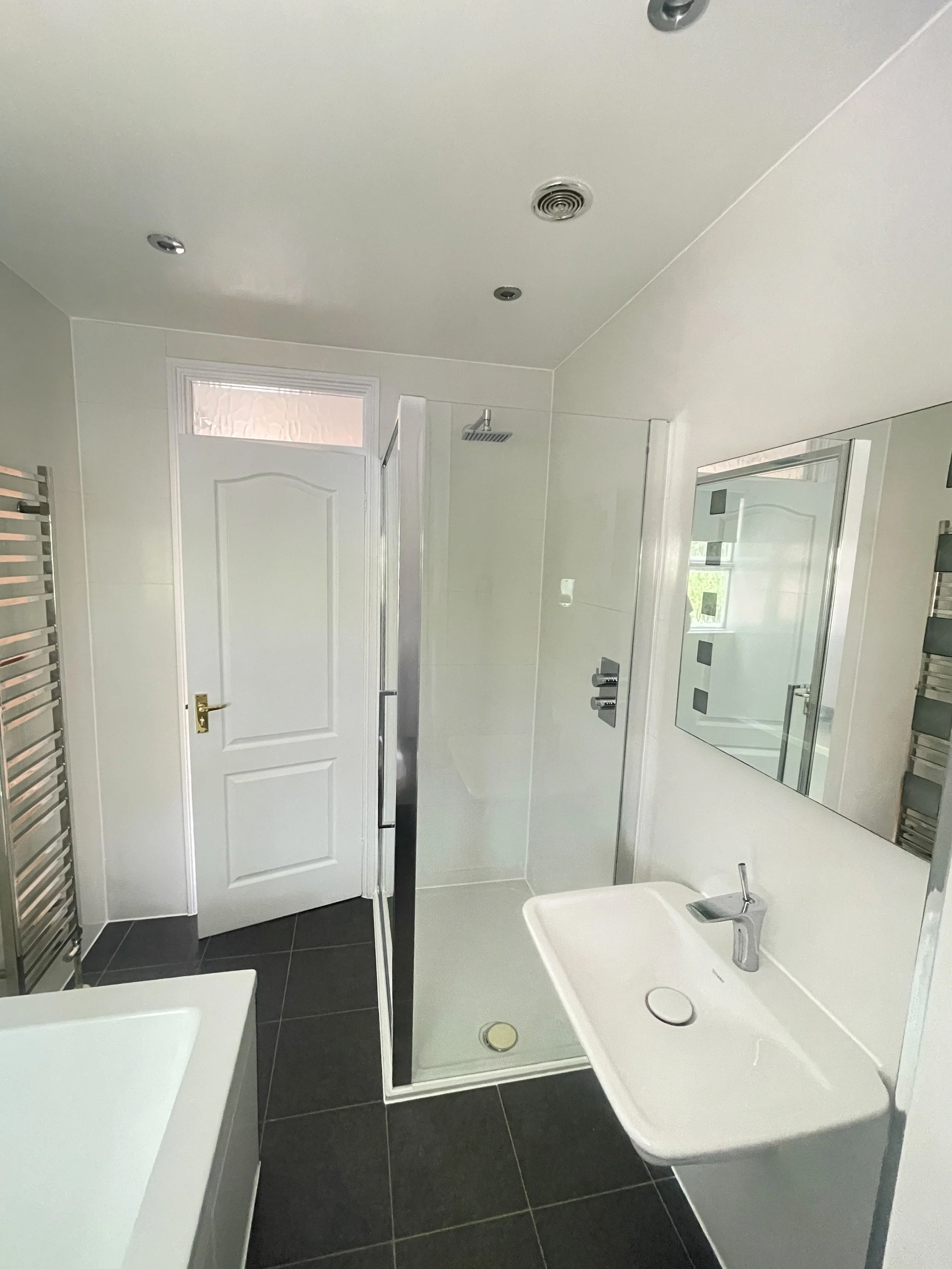 Newly renovated bathroom with walk-in shower and modern fixtures in London