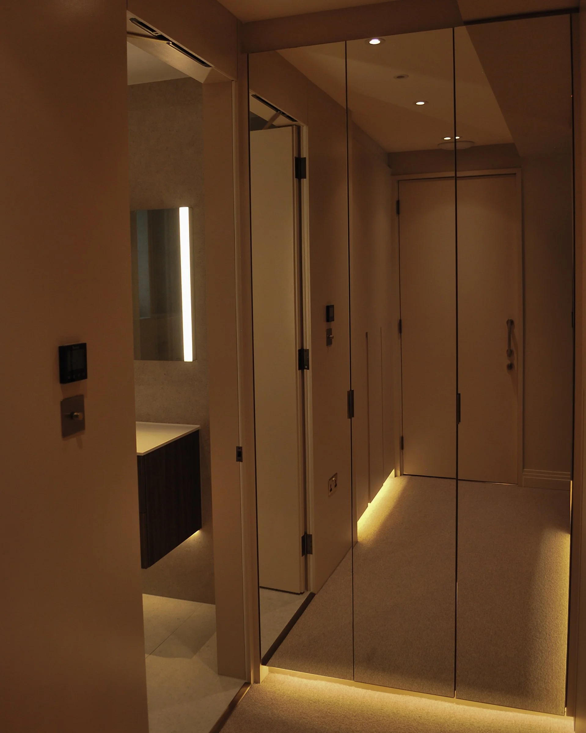 London interior with layered wall and ceiling lighting controlled as part of the room design