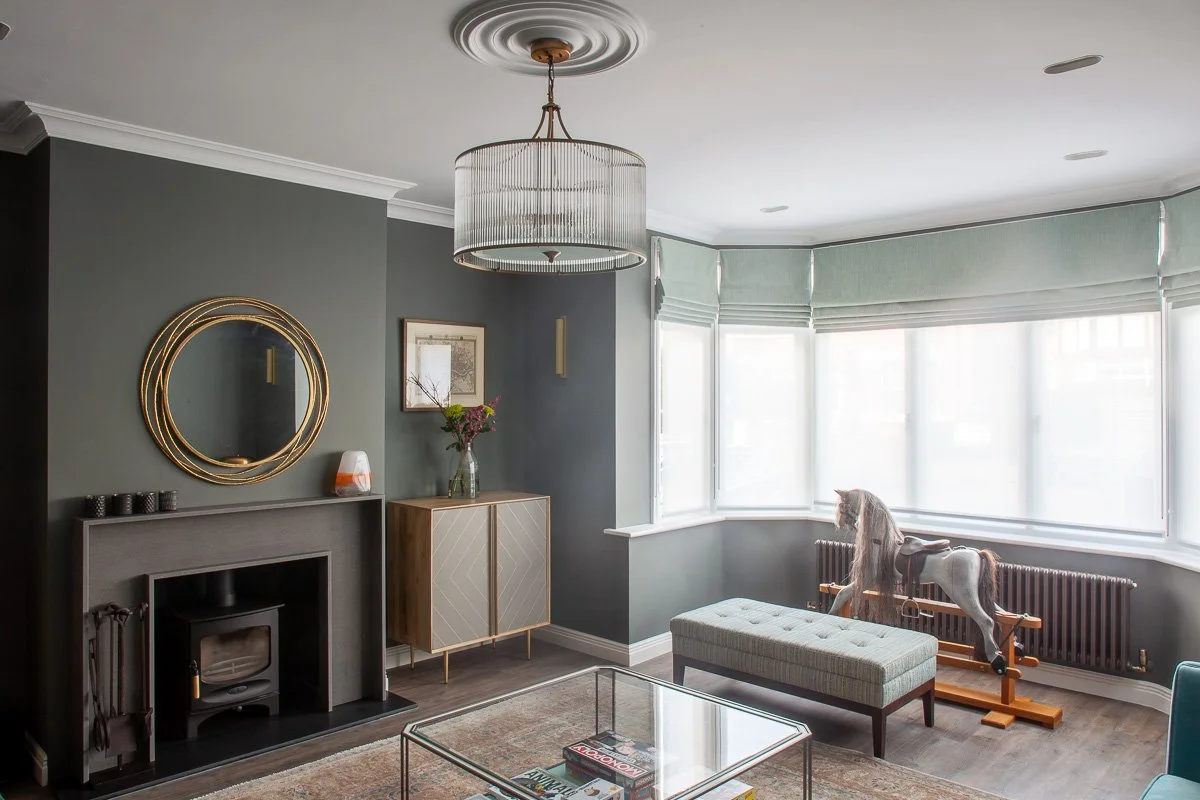 Completed London living room with a traditional radiator integrated into the refurbished interior