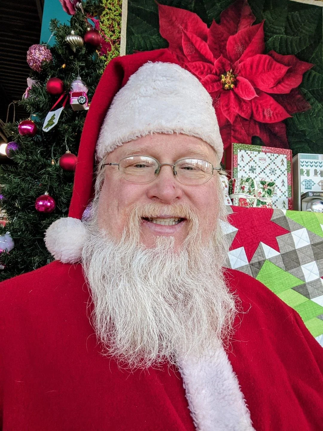 Cartoon woman with white hair wearing a Santa hat, smiling, with a red background.