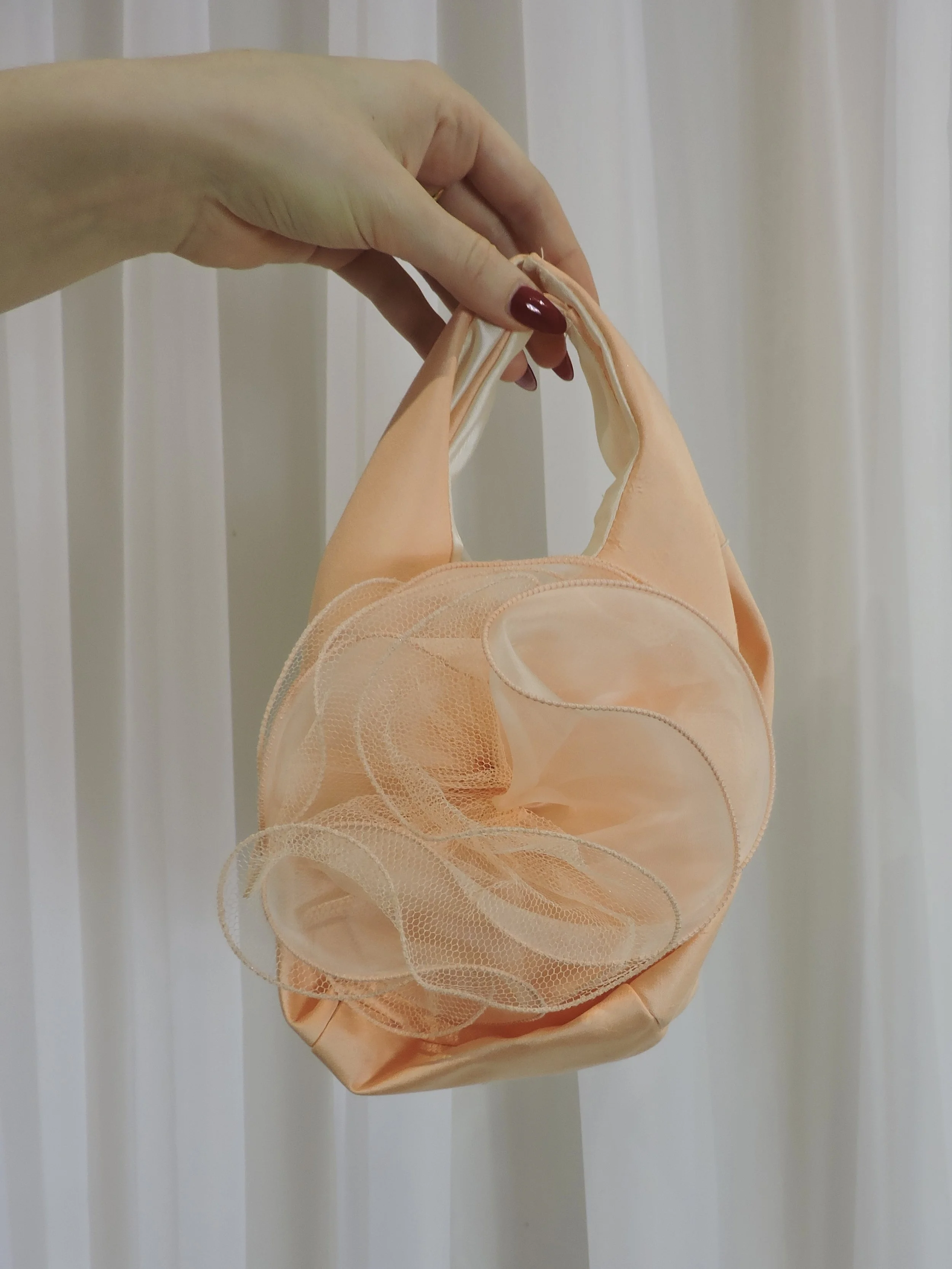 Vintage 1980s peach taffeta evening bag with floral net rosette