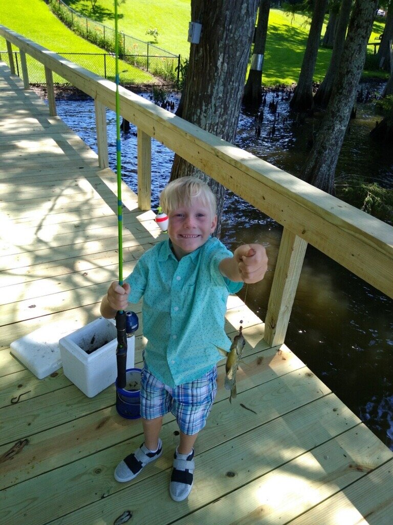  Hayden, fishing for bream with “Uncle” Lawrence, who is actually cousin Lawrence, but who’s splitting hairs? 