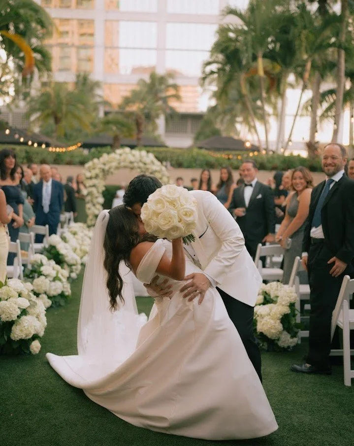 That dip at the end of the aisle was everything.

Jessica and Alex at the Ritz Carlton Coconut Grove- a full floral arch, white blooms lining every step, and a first kiss that had the whole crowd leaning in🤍

Planner @stephanieverrmareventco @stepha