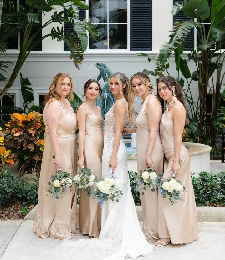 Champagne satin, blue and white florals, and a wedding party that made every moment feel like a celebration. Ashton &amp; Michael 🤍

Planning: @stephanieverrmareventco @stephanieverrmar 
Photography: @berkleymcgaugheyphotography
Videography: @thekai