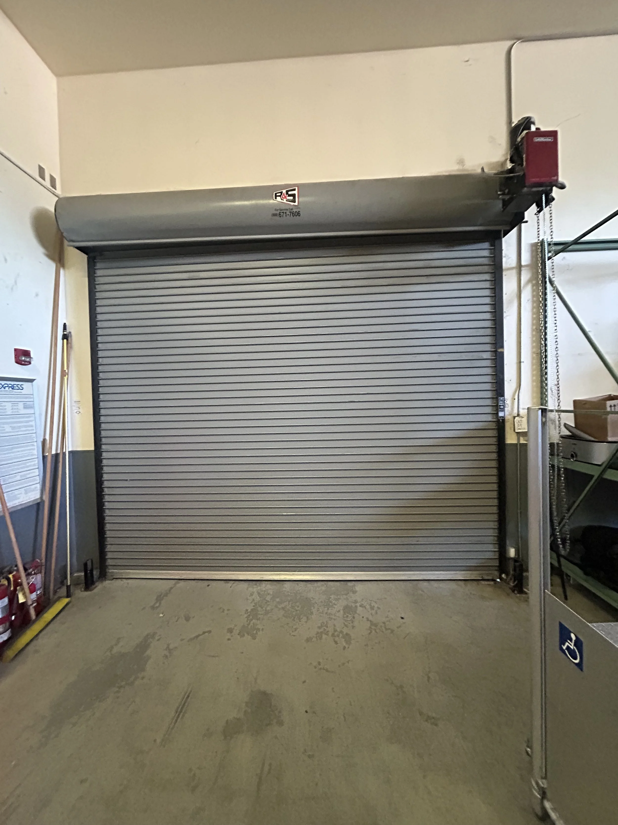 Repairing rolling steel door hit by car in Martinez, CA