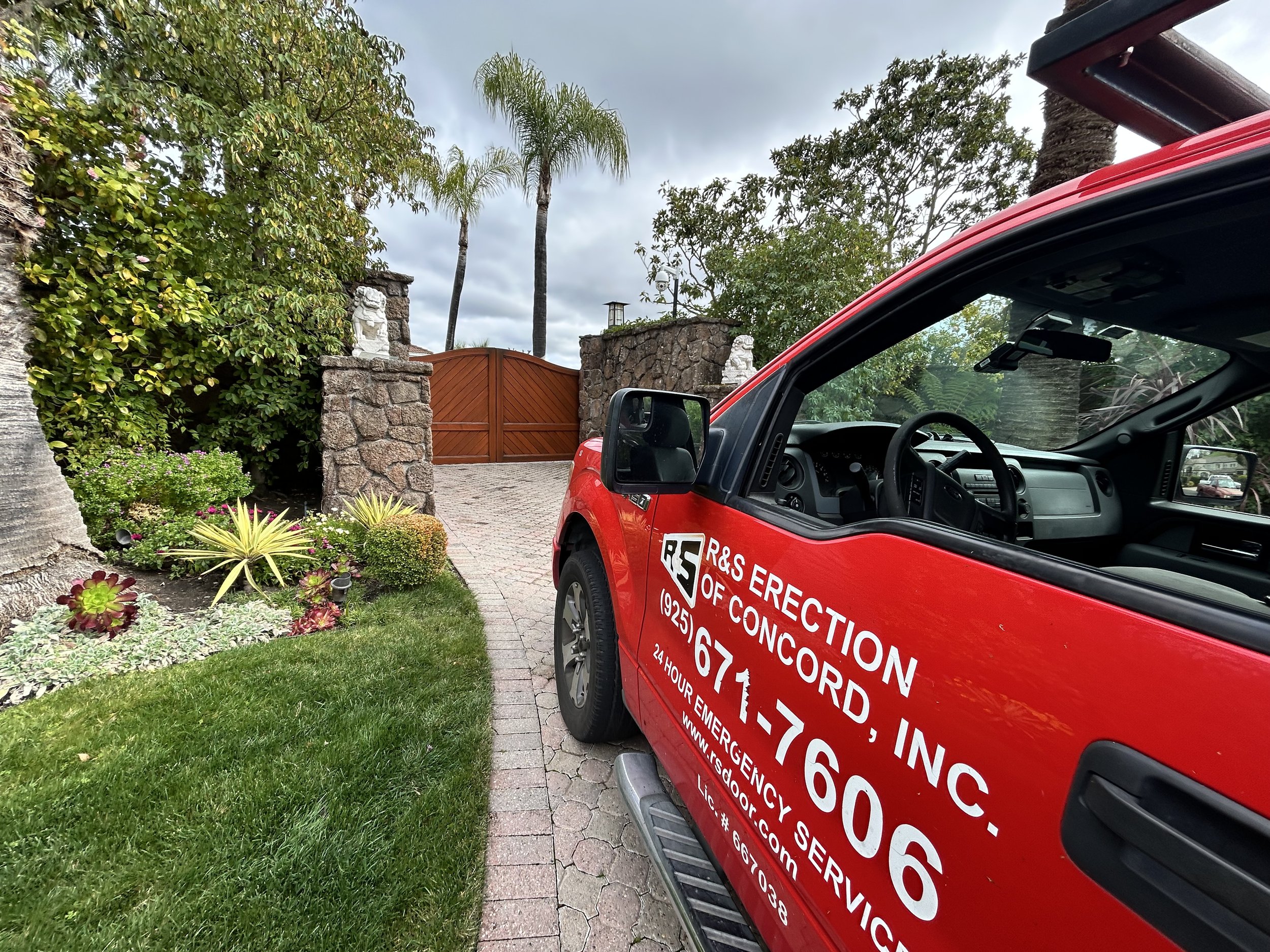 R&S Concord red truck in front of gate during service call