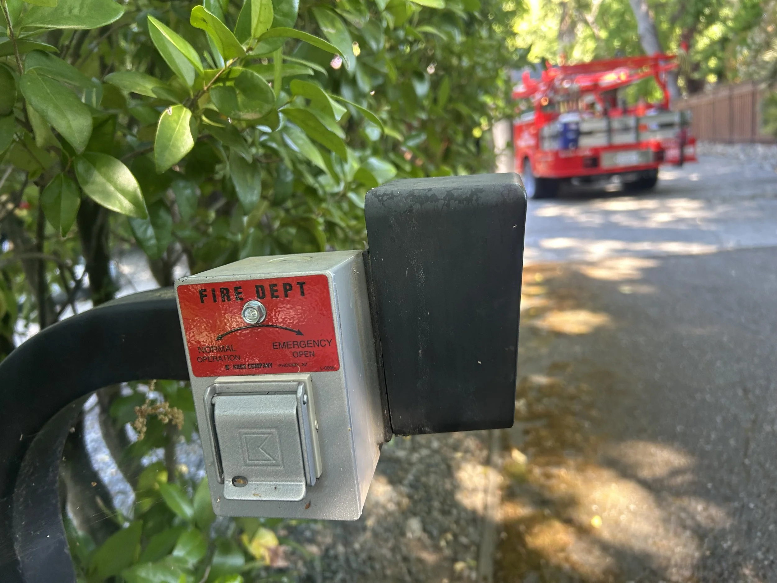 A fire department key switch, or Knox box, for an automatic gate
