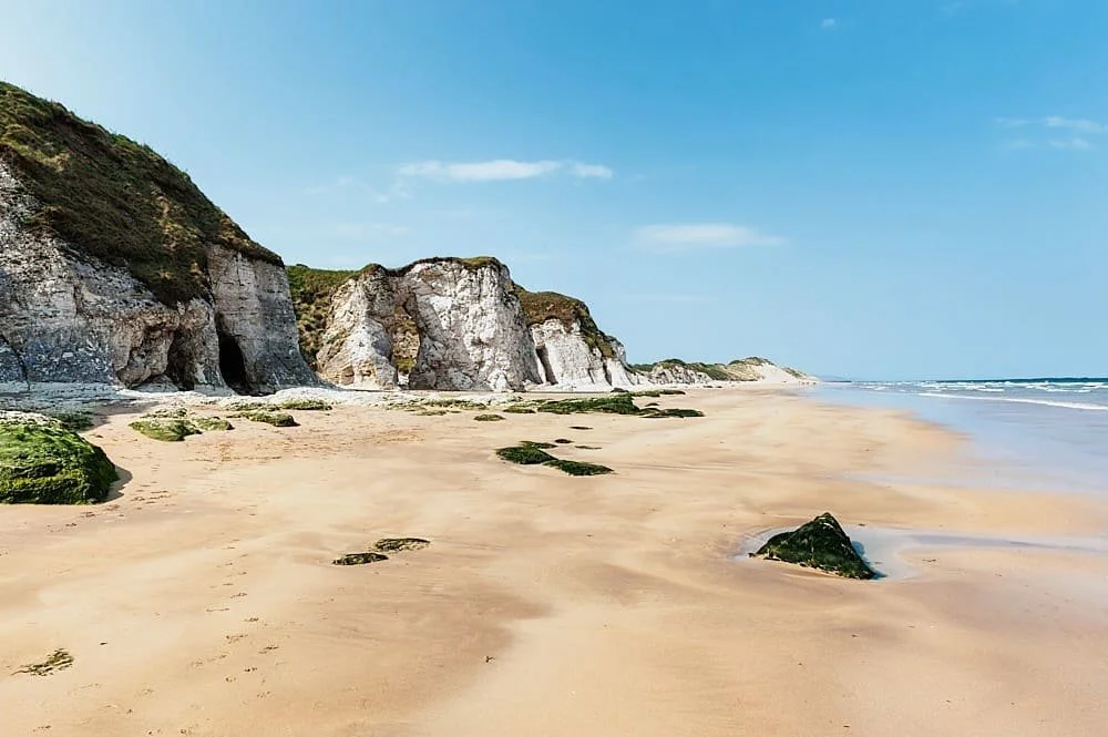 Whiterocks Beach near Portrush with white limestone cliffs and golden sand