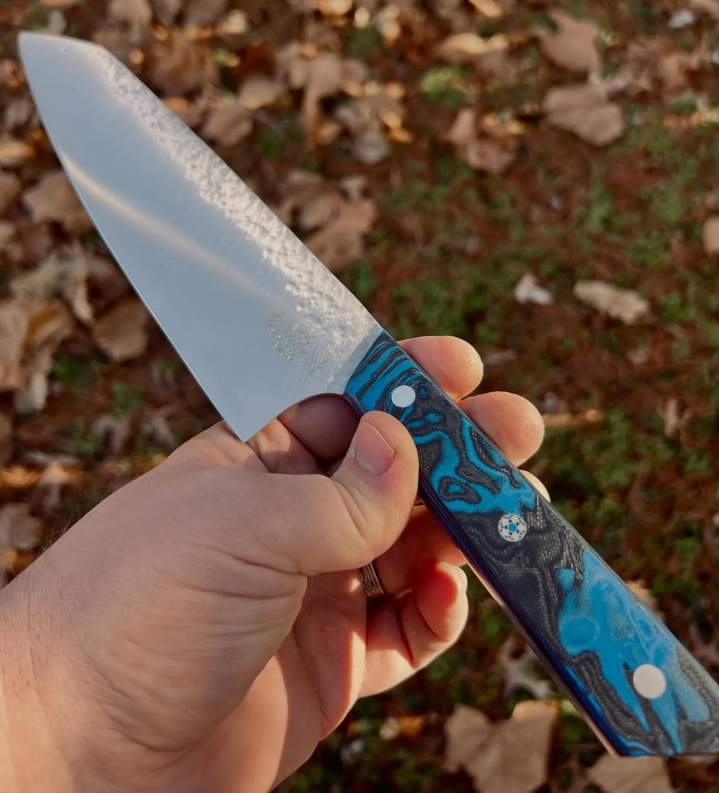 A chef with a bit of hammered finish and blue lava G10