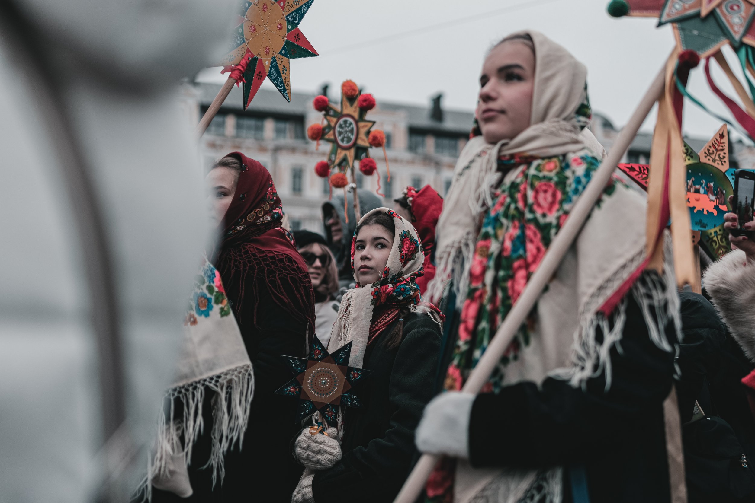 A girl dressed in traditional attire stands together with others at St. Sophia Square during the Christmas procession with stars in Kyiv, Ukraine on December 25, 2025. The event celebrates Ukrainian Christmas traditions and symbolizes unity and cultu