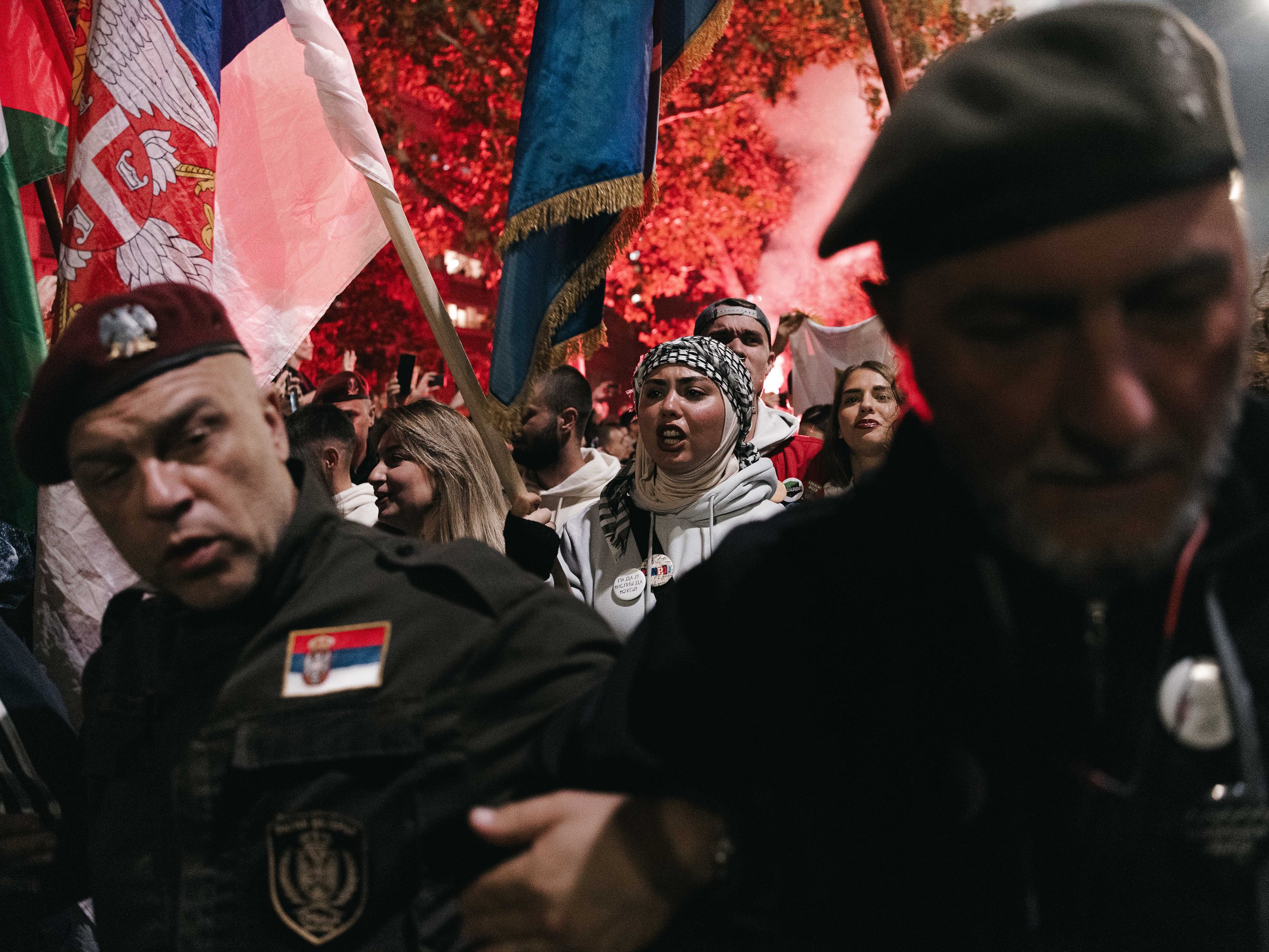 War veterans who support the march stand ahead of the arriving group, clearing the way as Serbian flags wave behind them, Novi Sad, Serbia, October 31, 2025. Their presence highlights the support for the student march from Novi Pazar, which is part o