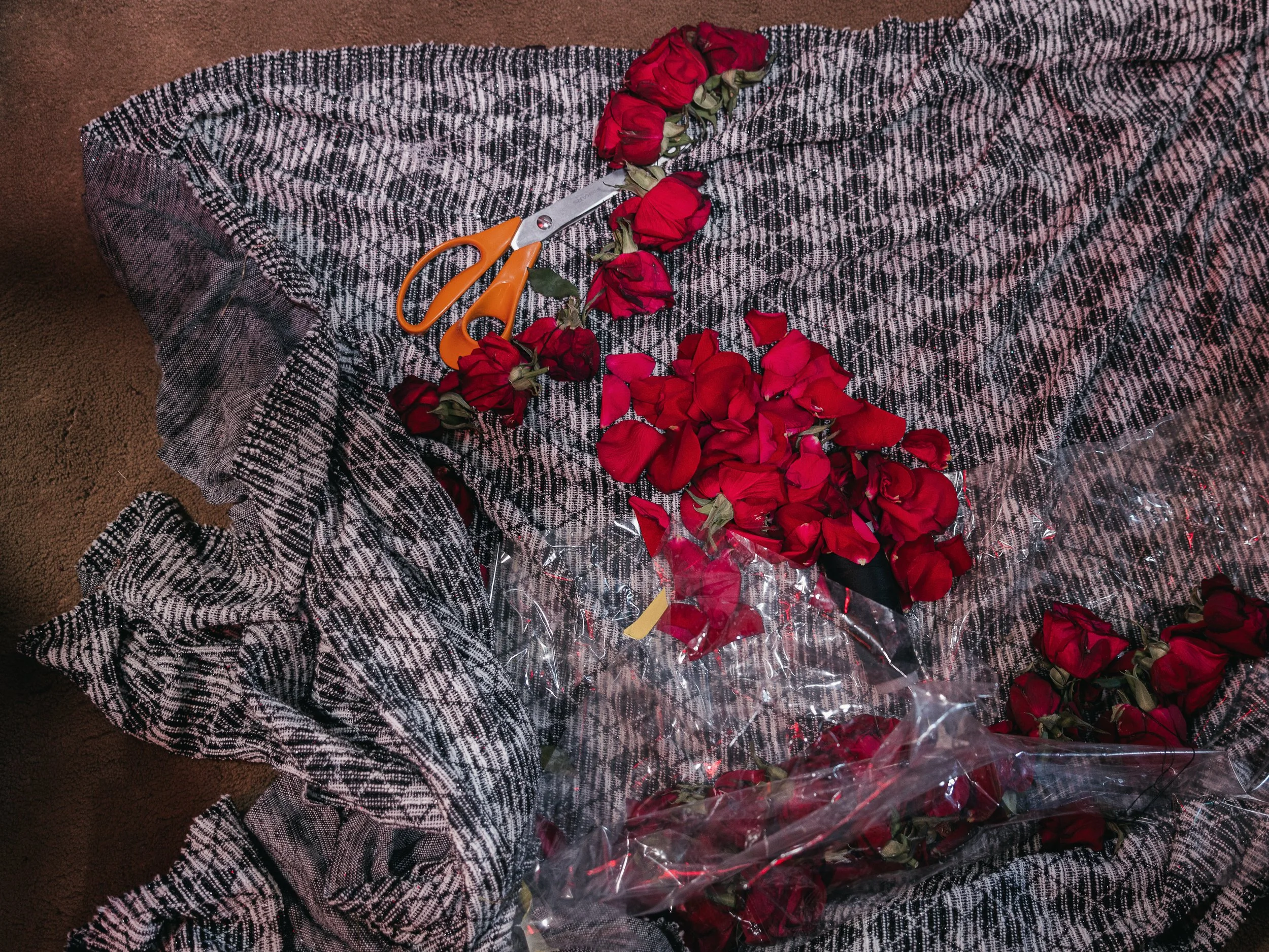 Flowers are placed on a fabric inside the self-organized Shi’a mosque in Peristeri, Athens, Greece on July 6, 2025. The flowers are part of the preparations for the Ashura rituals, symbolizing respect and remembrance for the martyrs of Karbala.