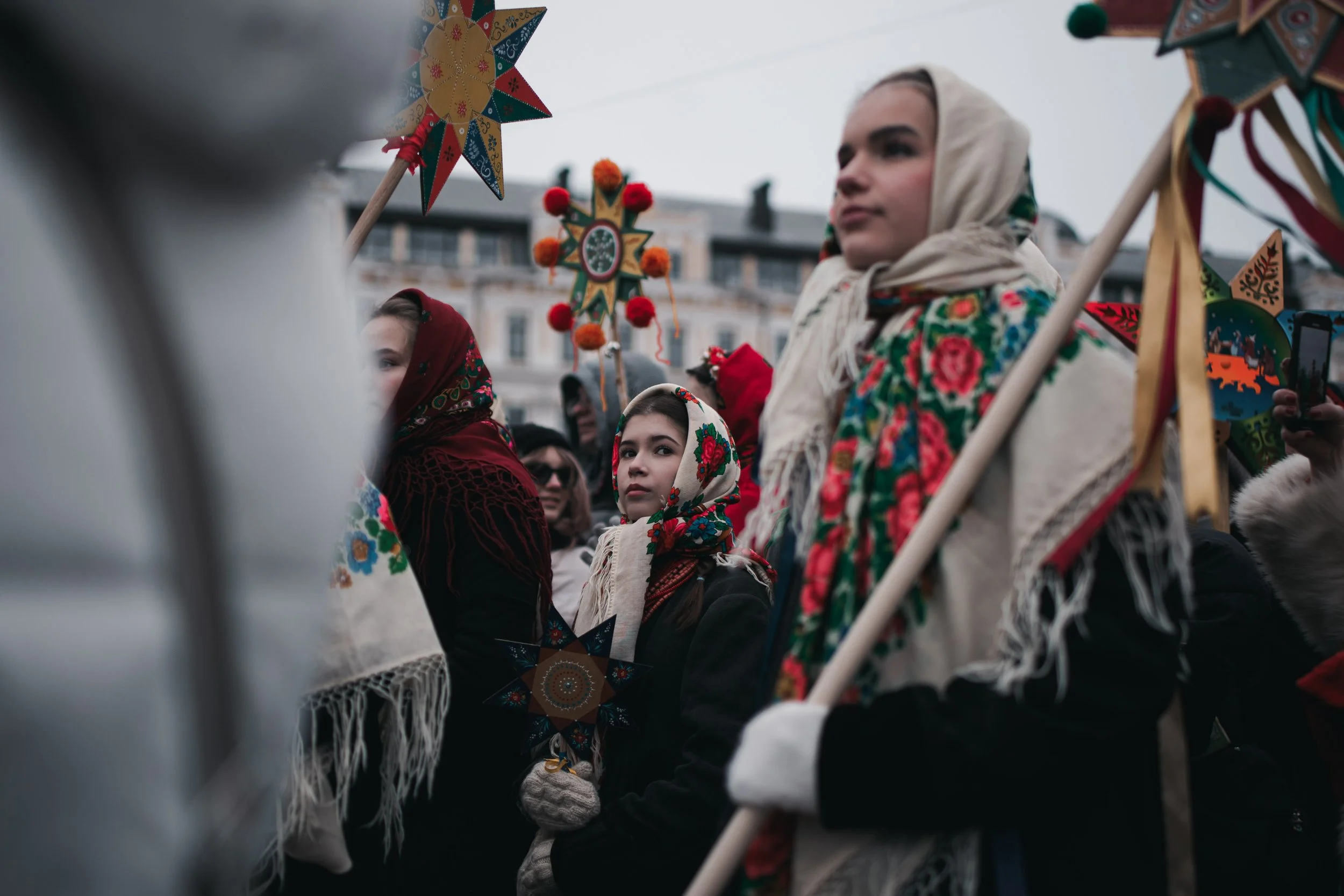 A girl dressed in traditional attire stands together with others at St. Sophia Square during the Christmas procession with stars in Kyiv, Ukraine on December 25, 2025. The event celebrates Ukrainian Christmas traditions and symbolizes unity and cultu