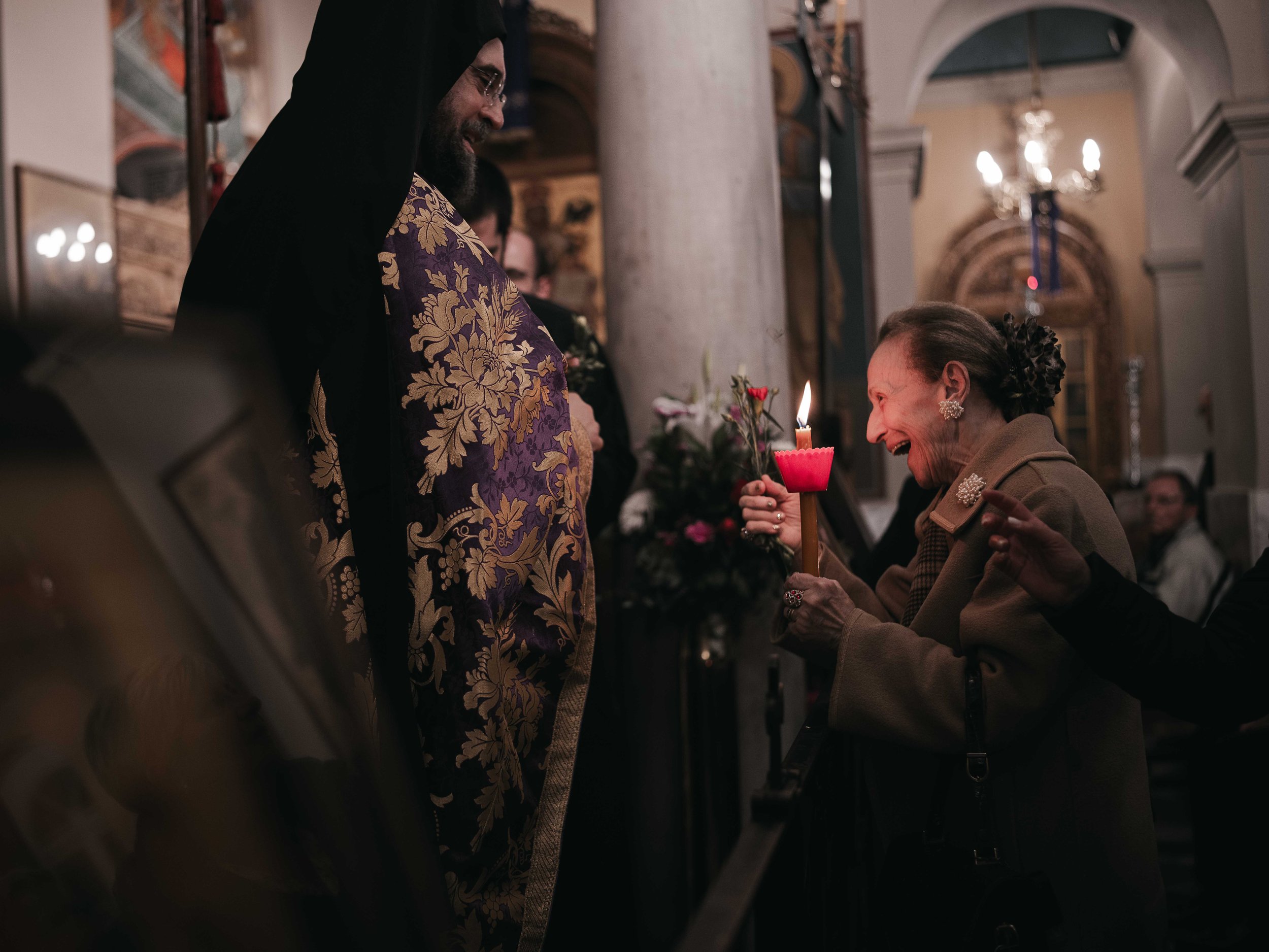 A priest gives a flower to an elderly woman during an Orthodox Easter service in Athens, Greece on 19 April 2025.
The moment is part of the midnight liturgy on Holy Saturday, commemorating the Resurrection.
