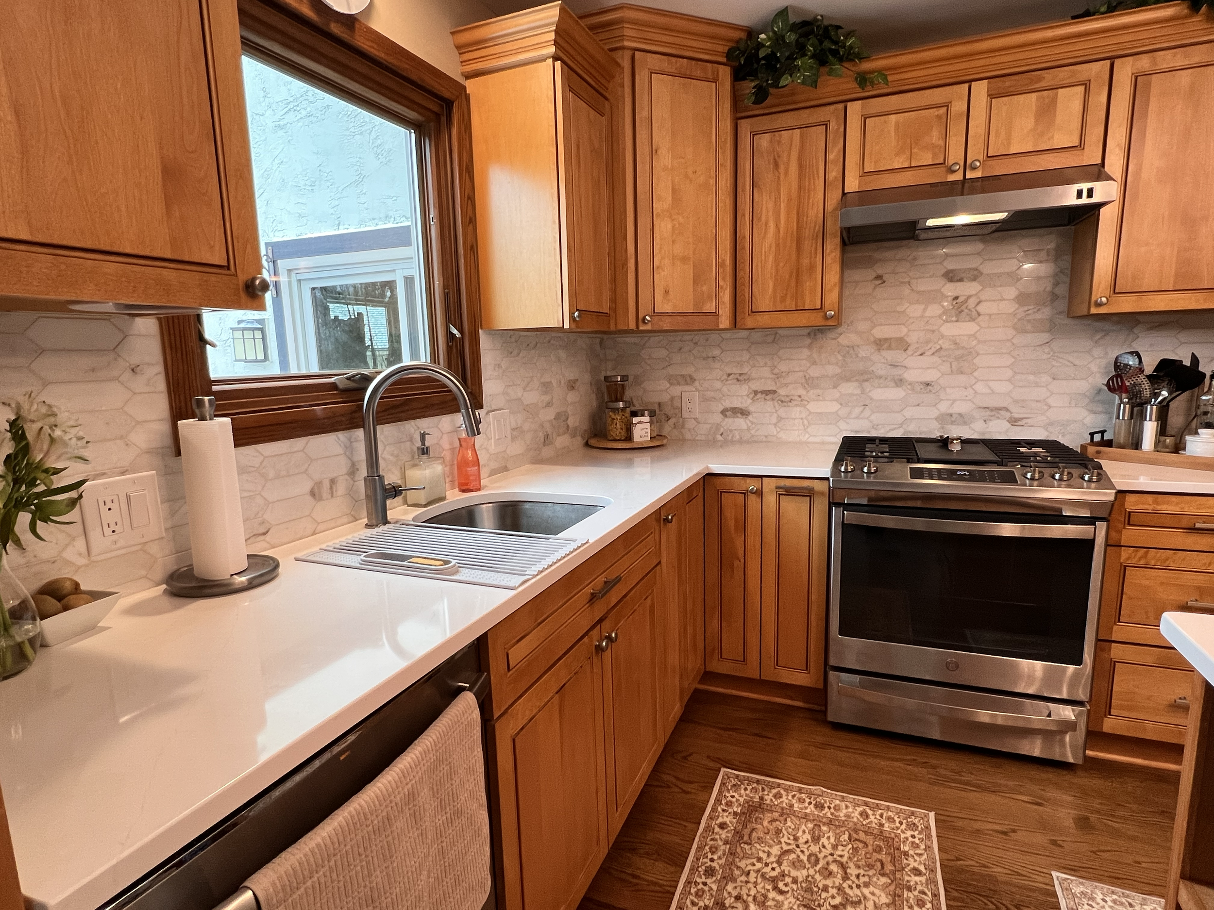 Kitchen remodel with custom cabinets, tile backsplash and formica countertops.