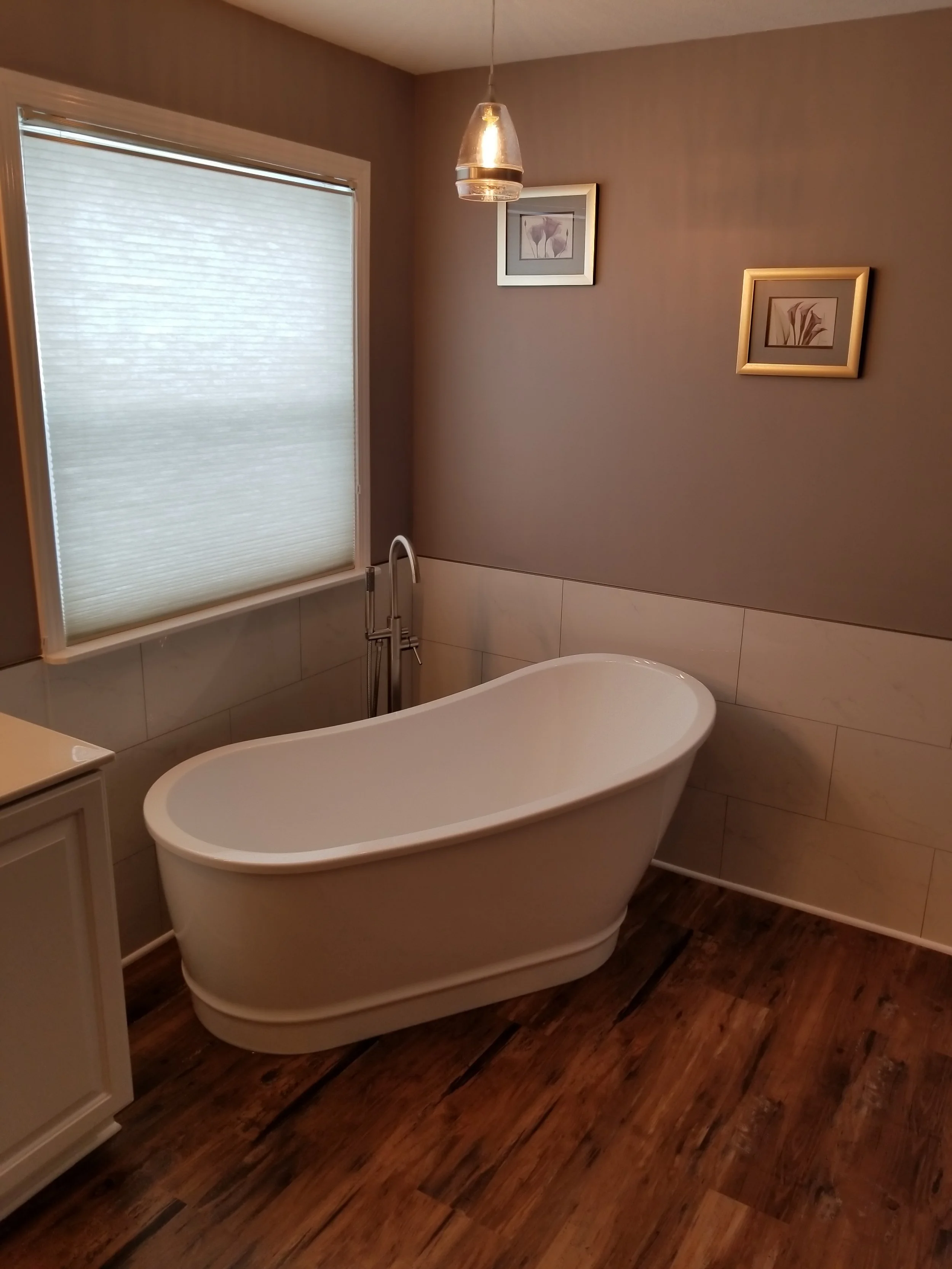 Bathroom renovation with freestanding bathtub.