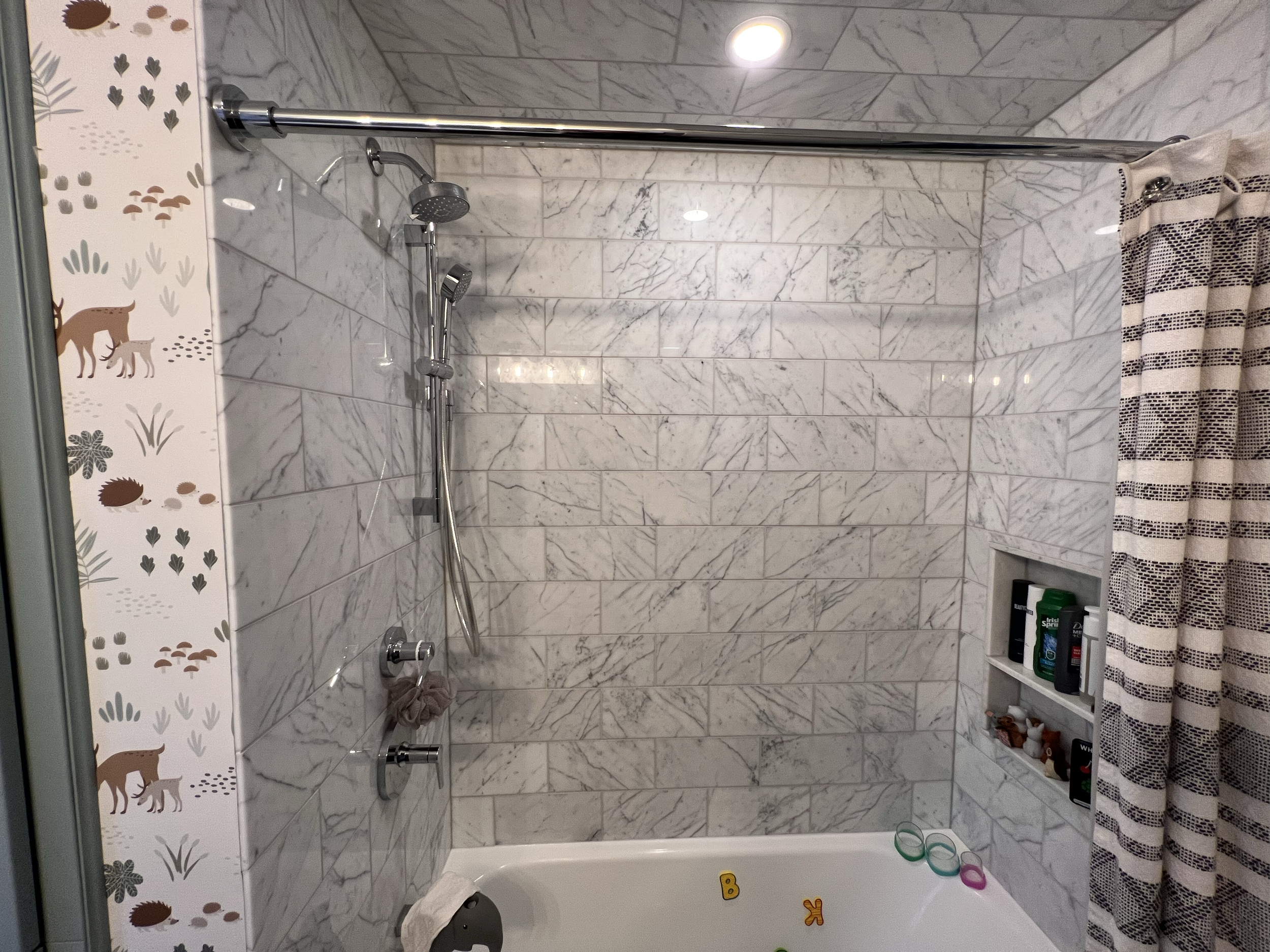 Custom marble shower tile surround bathroom renovation.