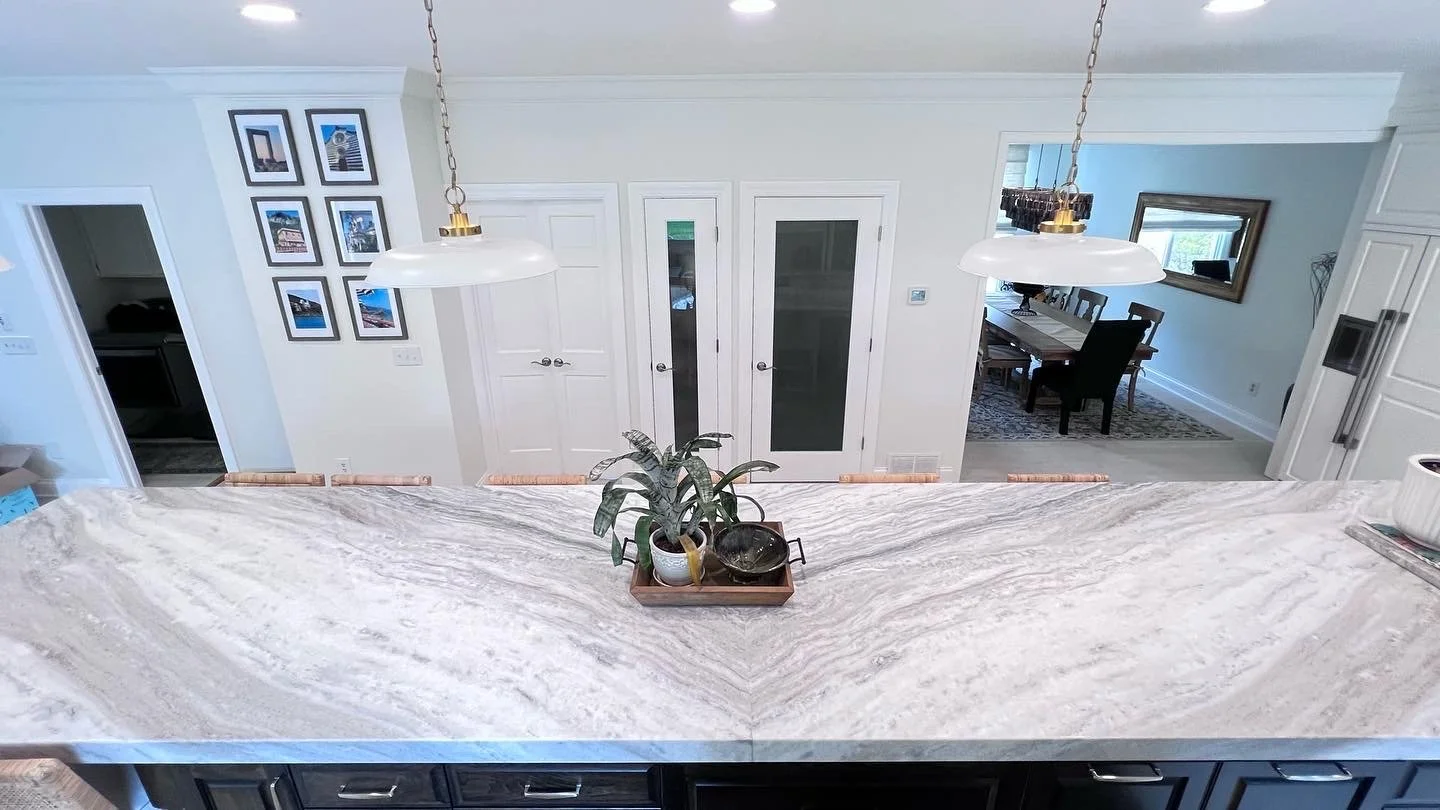 Twenty foot granite slab island for eat-in kitchen, seating for eight.