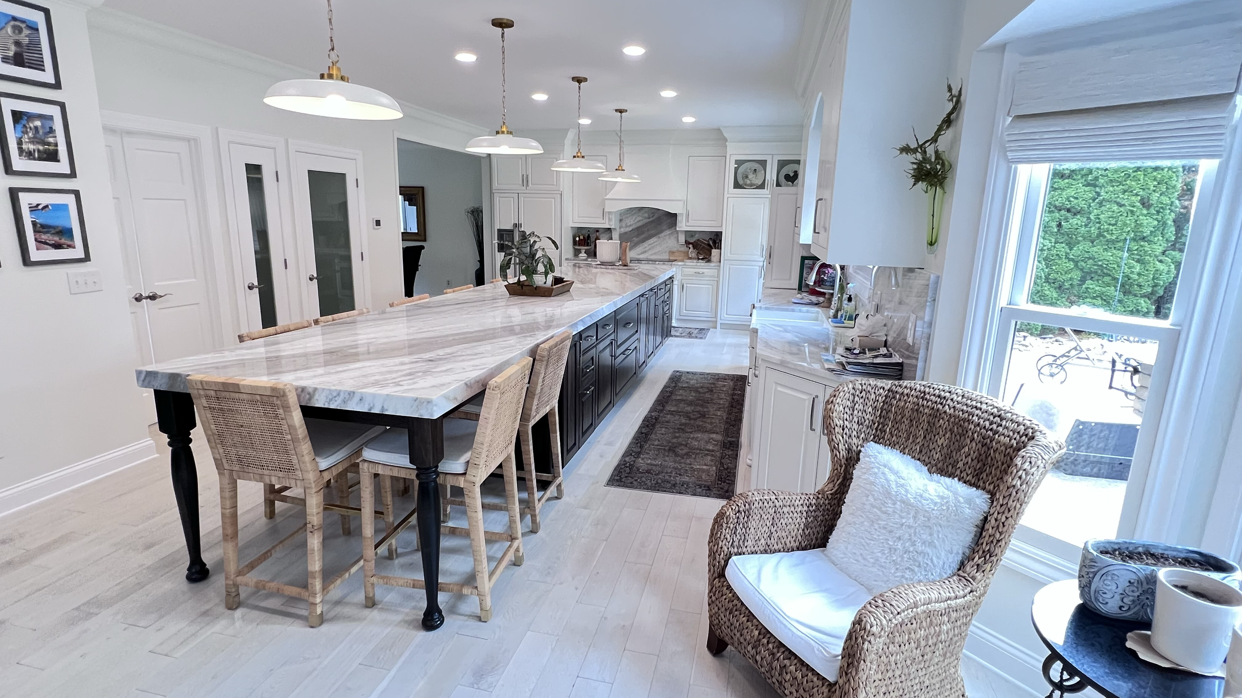 Kitchen remodel with new flooring, lighting, cabinets and custom island countertop.