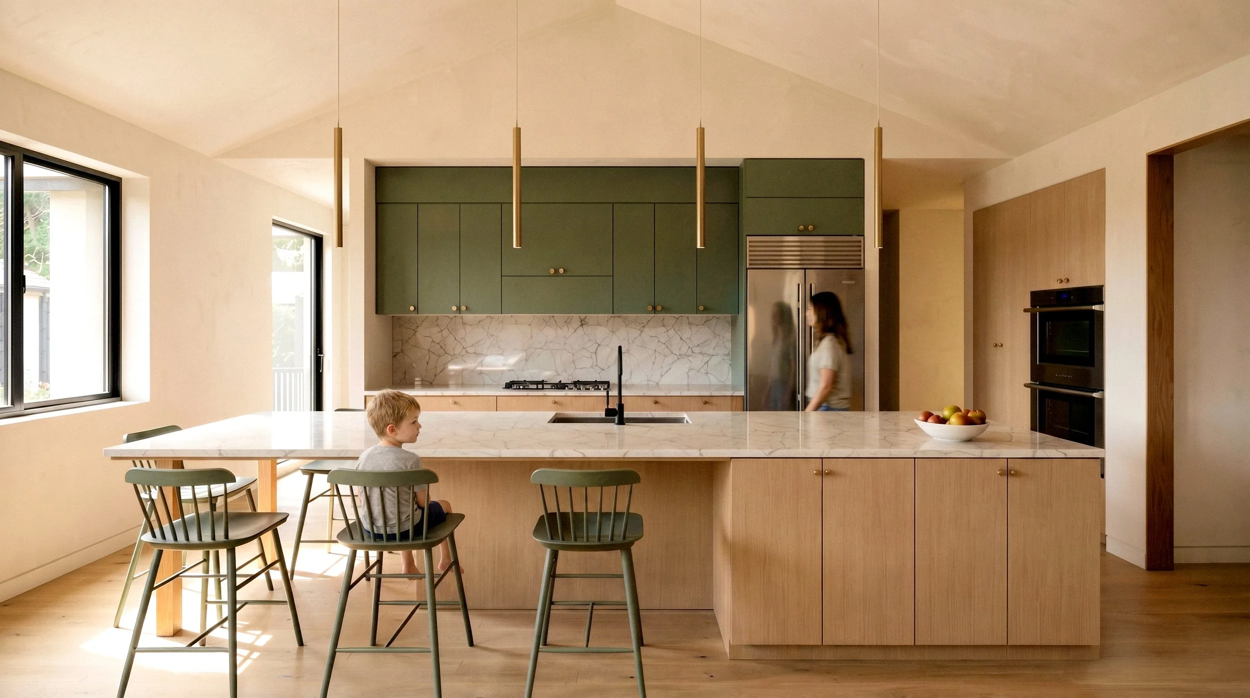 Contemporary kitchen design with light wood cabinetry and a central stone island in a custom residential home.