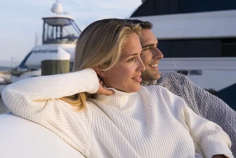 Couple enjoying the scenery on a winter yacht event