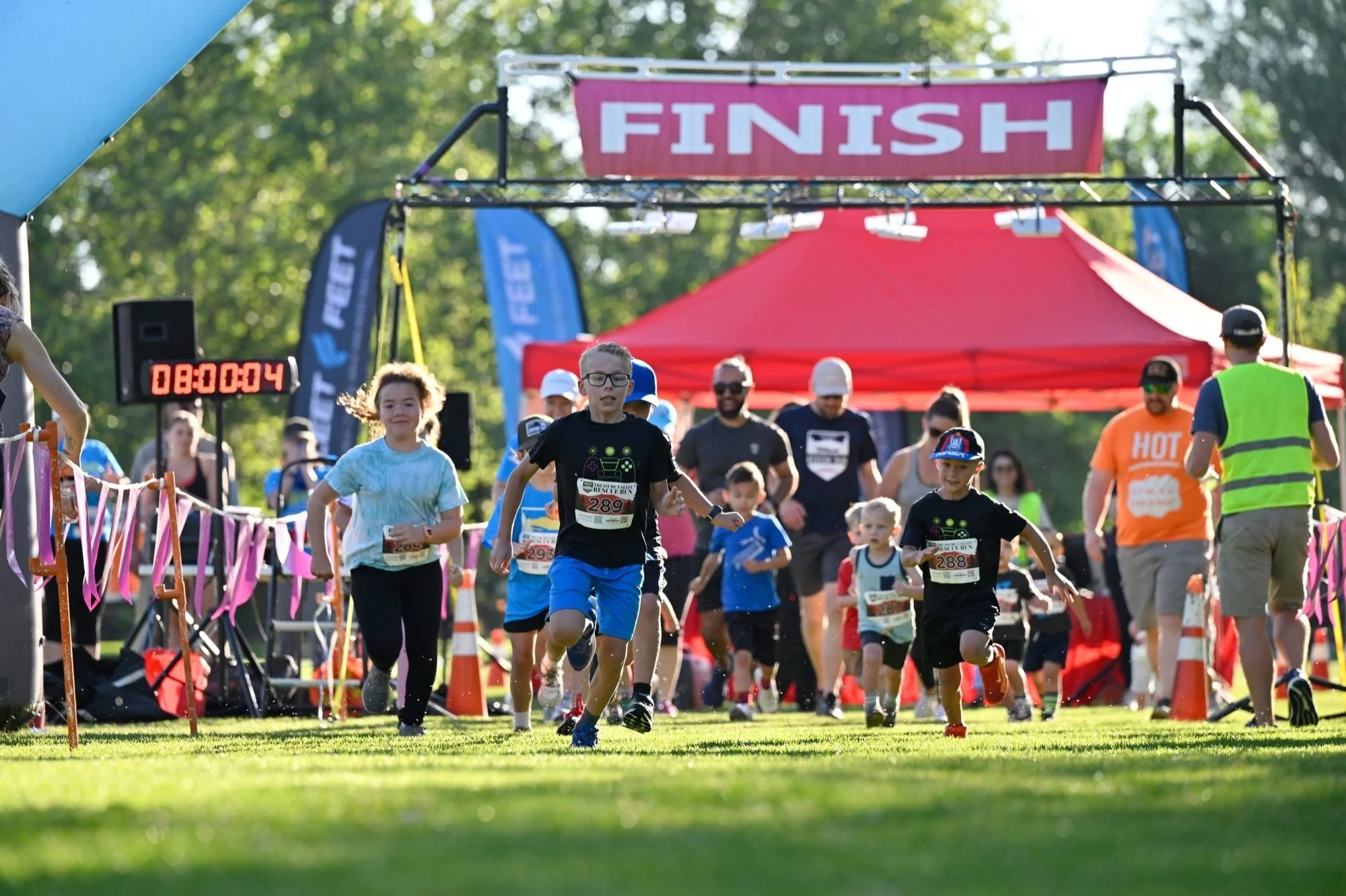Kids sprint off the start line of the free kids dash at the Treasure Valley Rescue Run