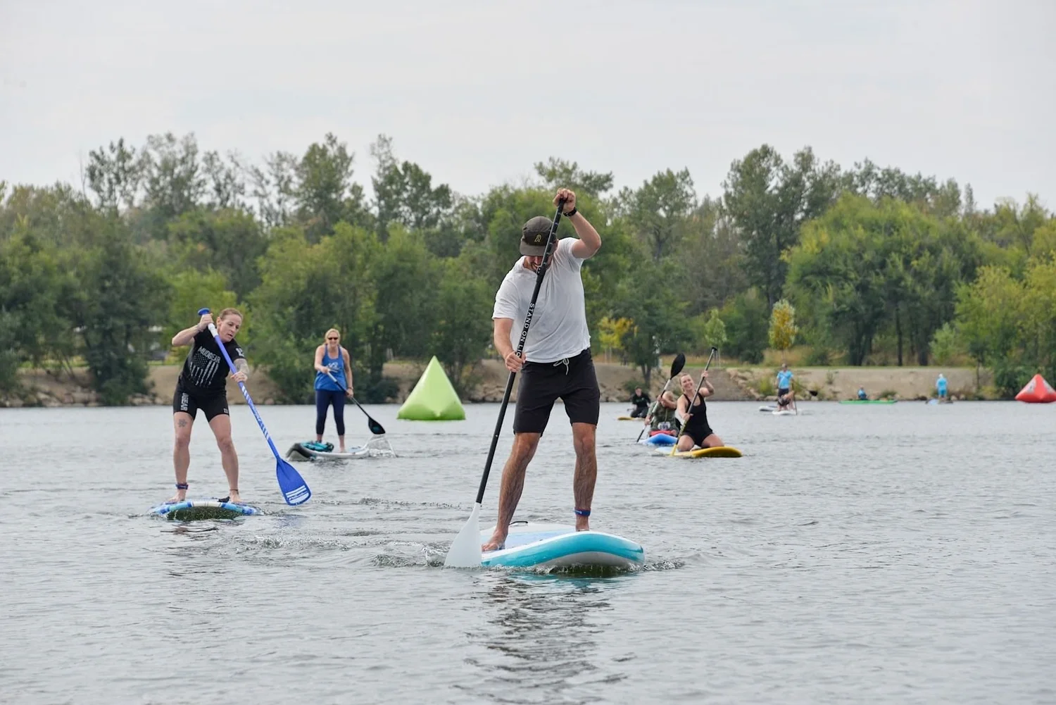 Paddleboarders head across Quinn's Pond at the Wild River Dash