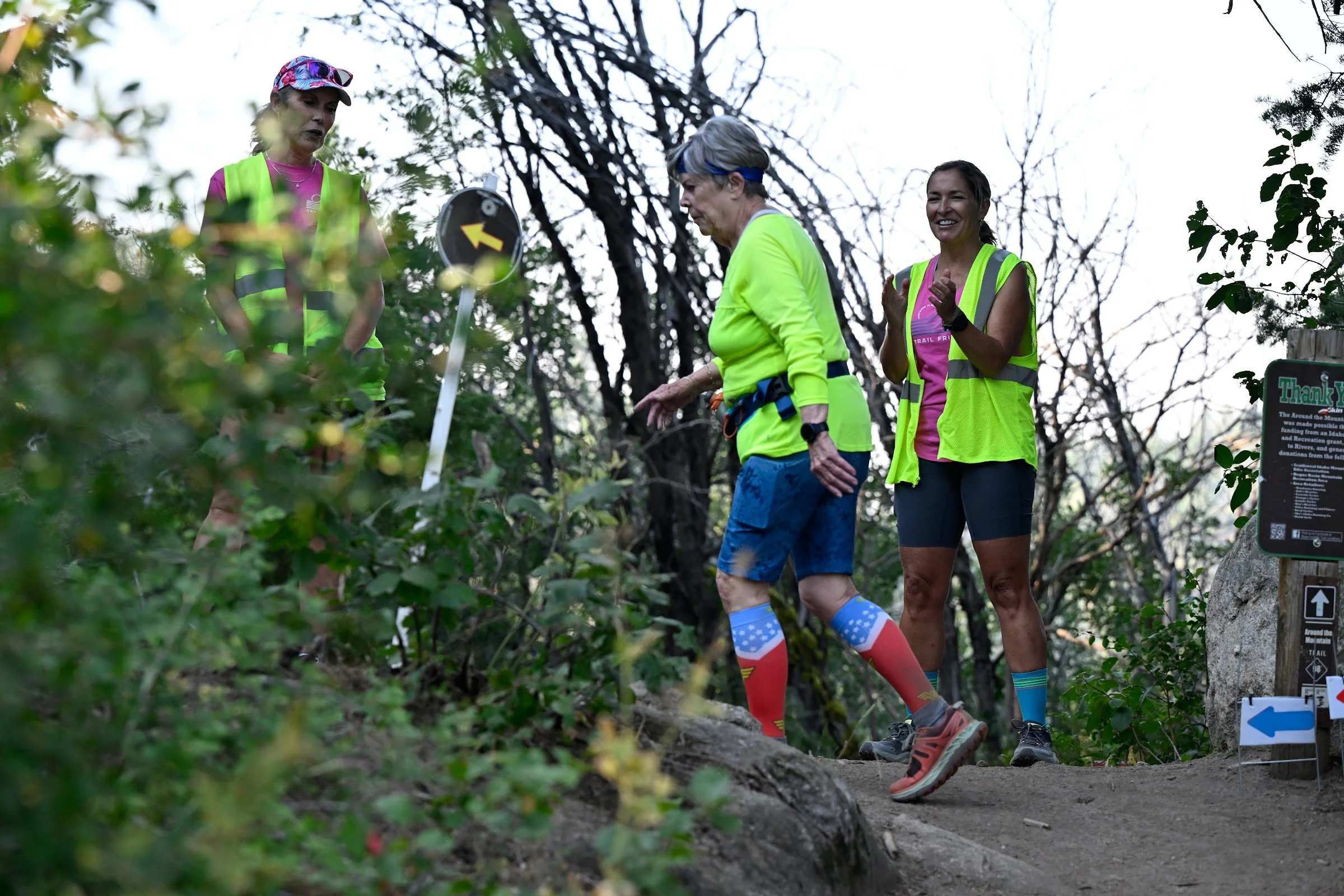 Trail runners scramble over rocks on a steep section of the Boise Front Trail Festival course