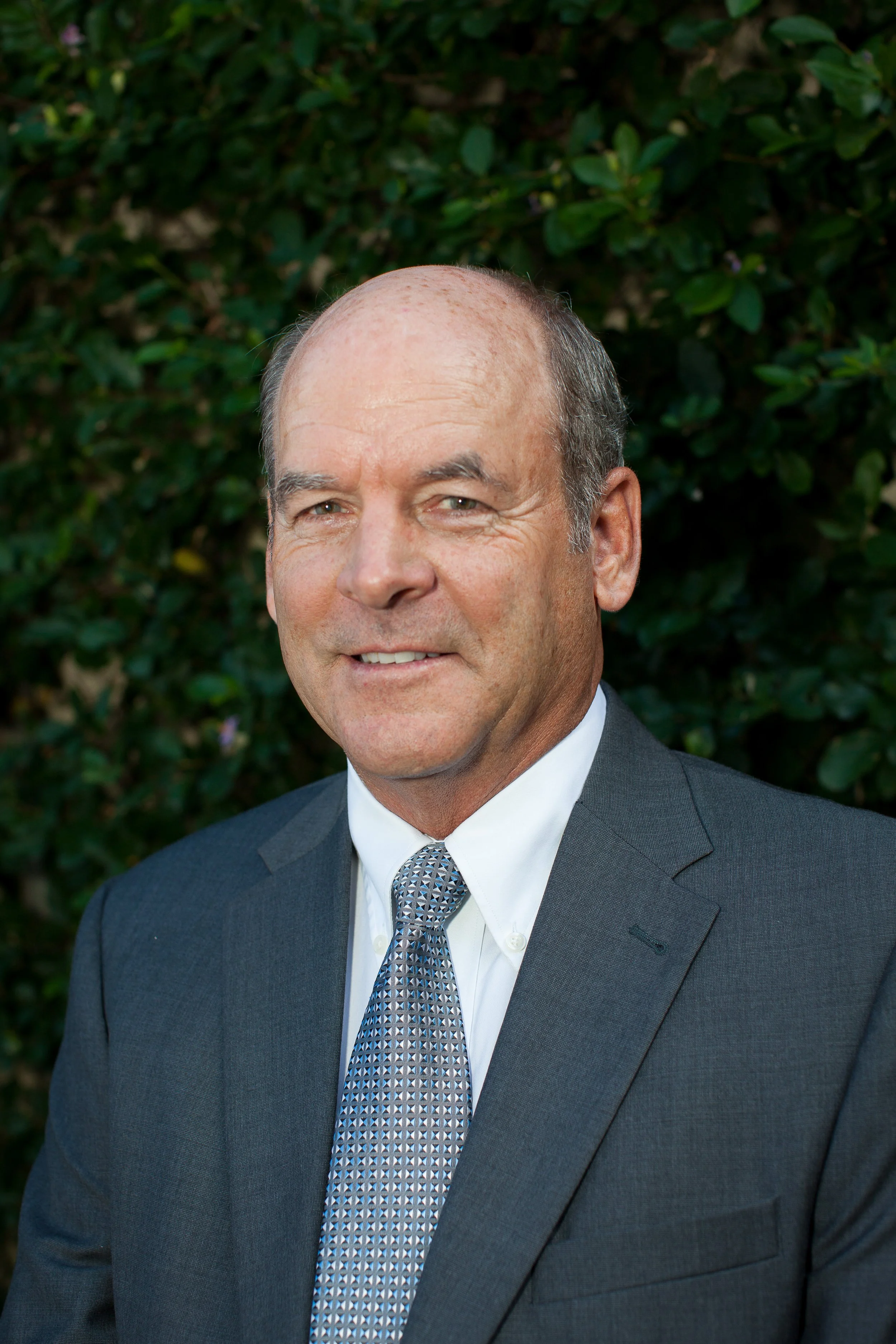 Bruce Berlinger - Formal Color Leave background Headshot.jpg
