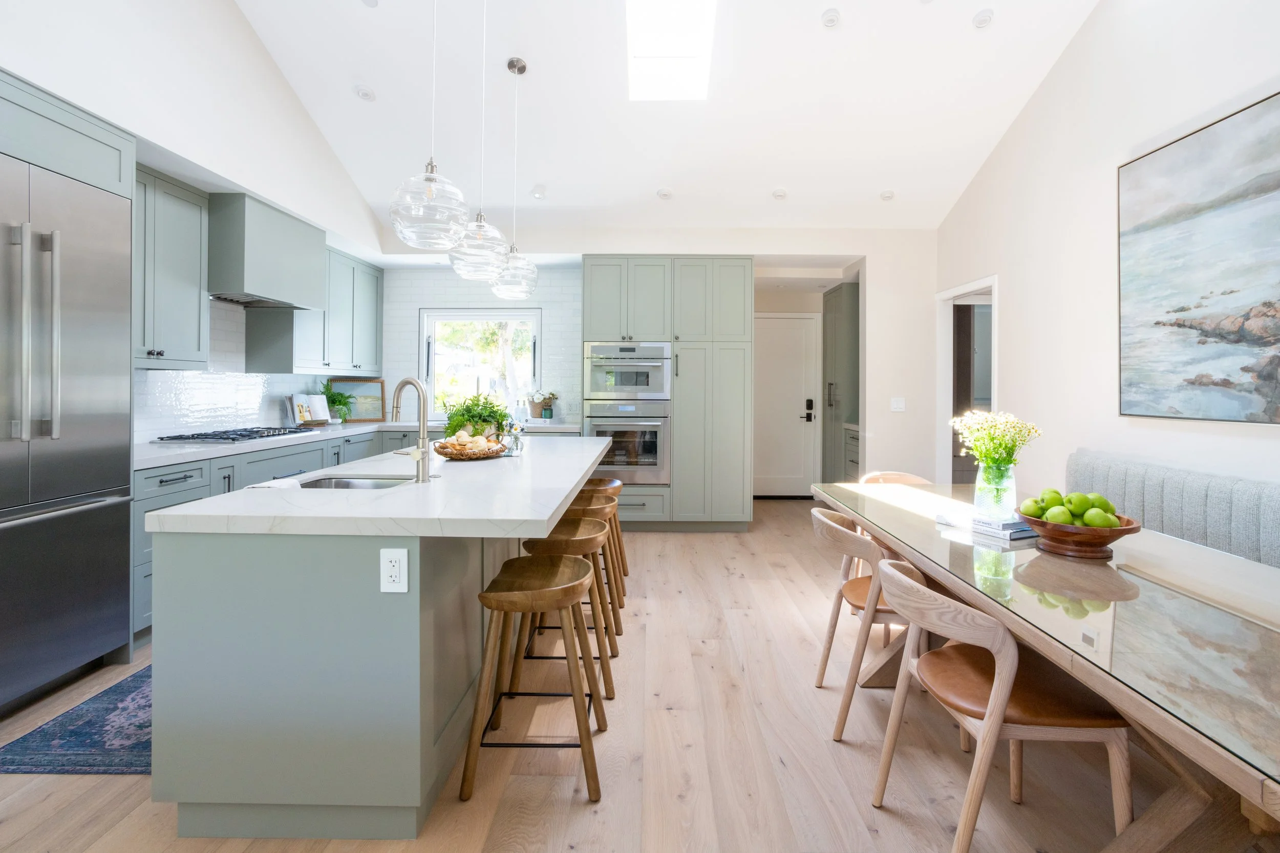 Kitchen pass-through with bar seating designed for casual entertaining in a vacation home