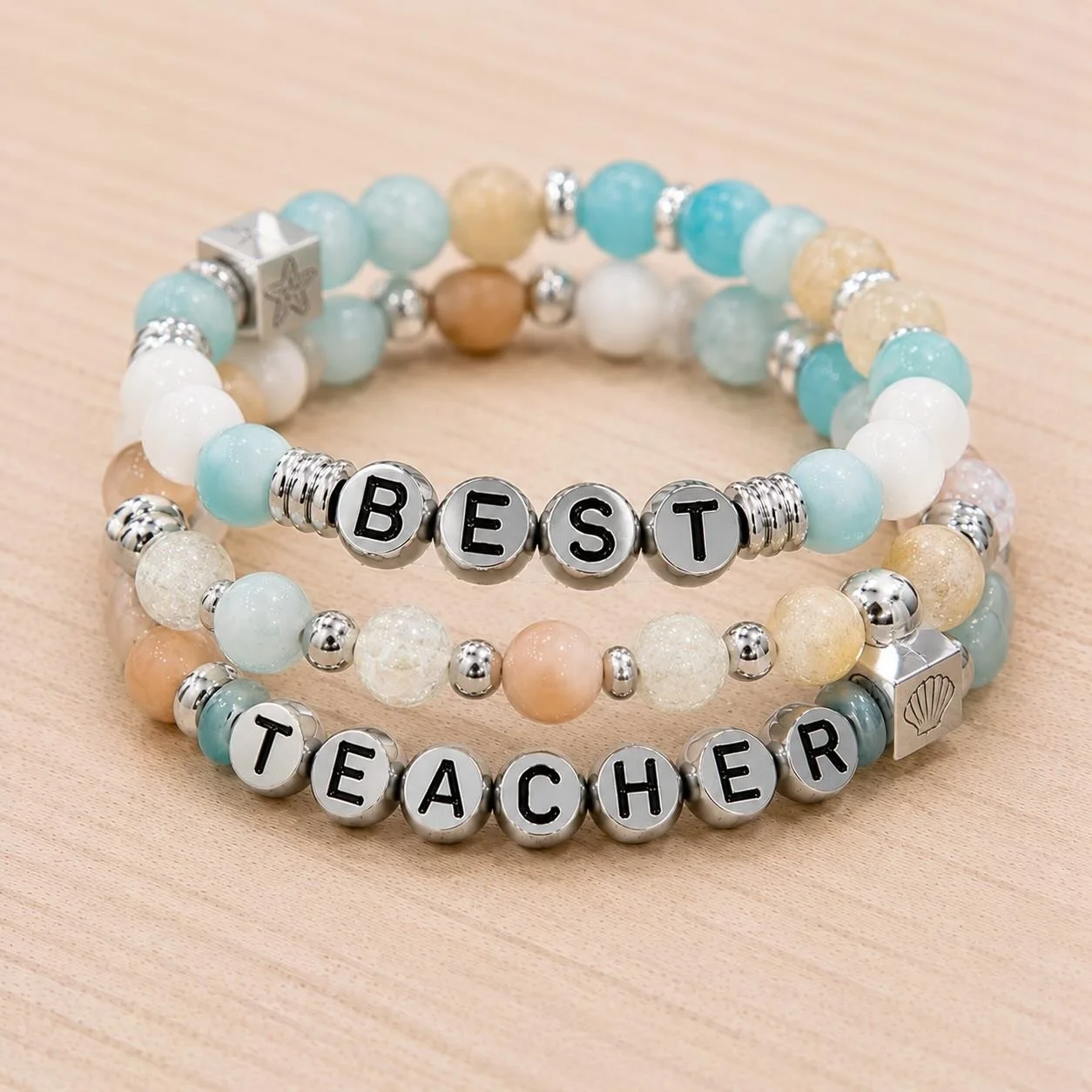 The sweetest end-of-year gift for the teachers who do it all 🤍✨

The BEST TEACHER stacks are here in so many dreamy color combinations 🫶beachy blues, soft pinks, neutrals, silver accents &amp; more 🌊🎀☀️

A little reminder for the teachers who mak