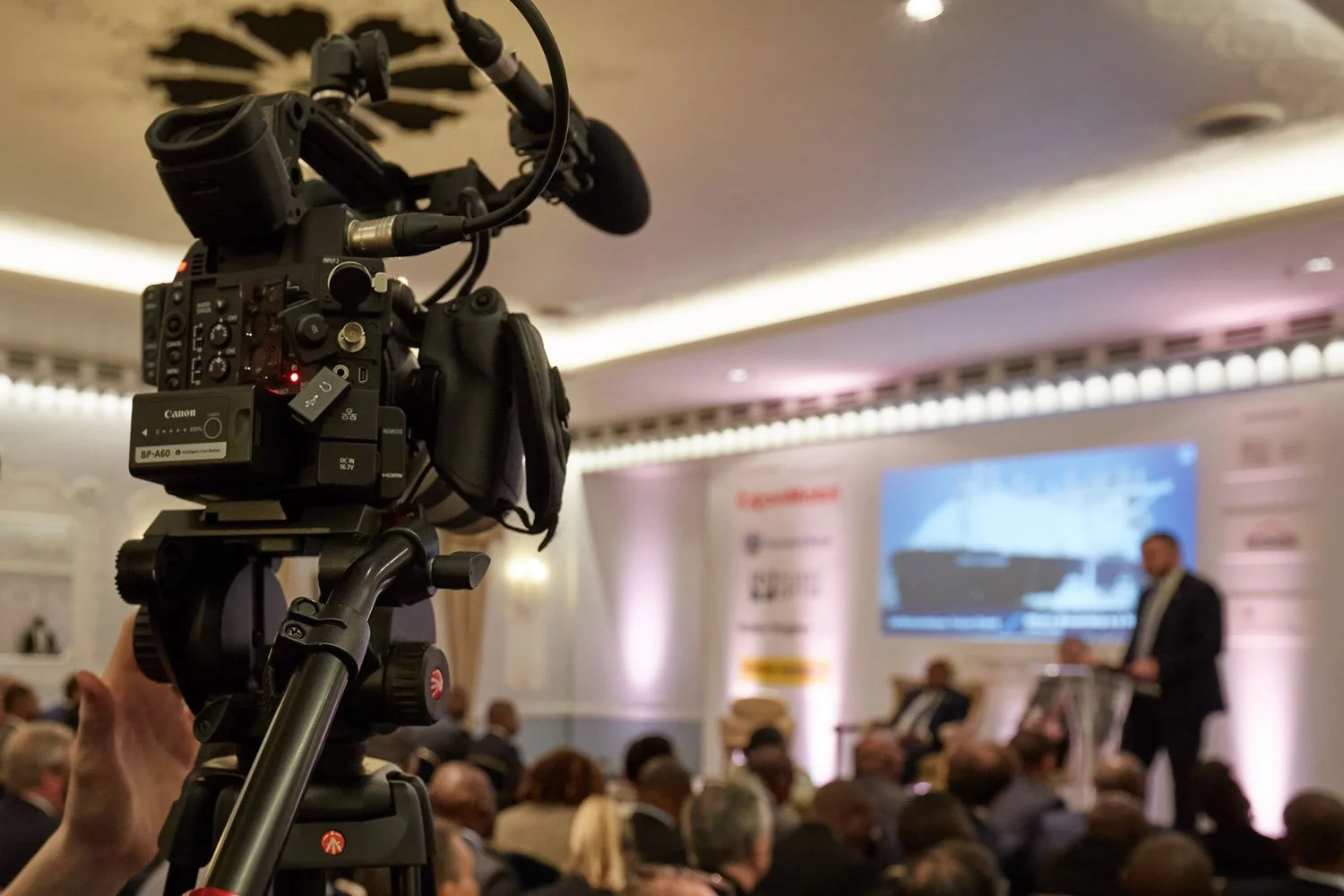 A professional videographer operating a video production camera during a corporate live stream event in Kitchener, Ontario.