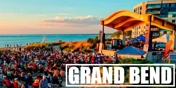A stunning sunset over a Lake Huron beach in Grand Bend, Ontario, with a music festival in full swing. Streaming Inc. captures the magic of local events with professional live streaming and video production.