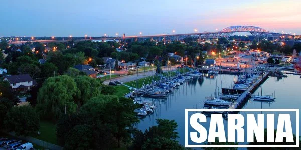 A stunning sunset over Sarnia's port and the Bluewater Bridge. Streaming Inc. helps businesses in Sarnia connect with audiences worldwide through professional live streaming and video production.