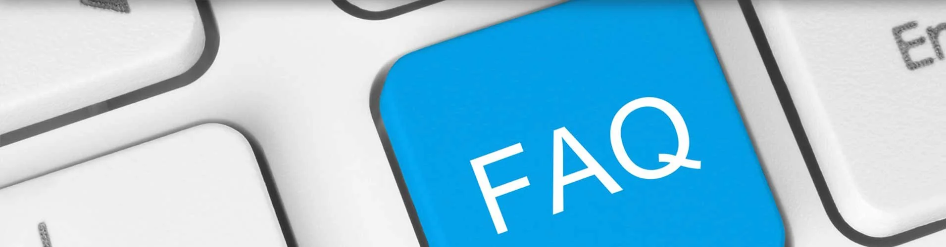 Computer keyboard with a key labeled FAQ