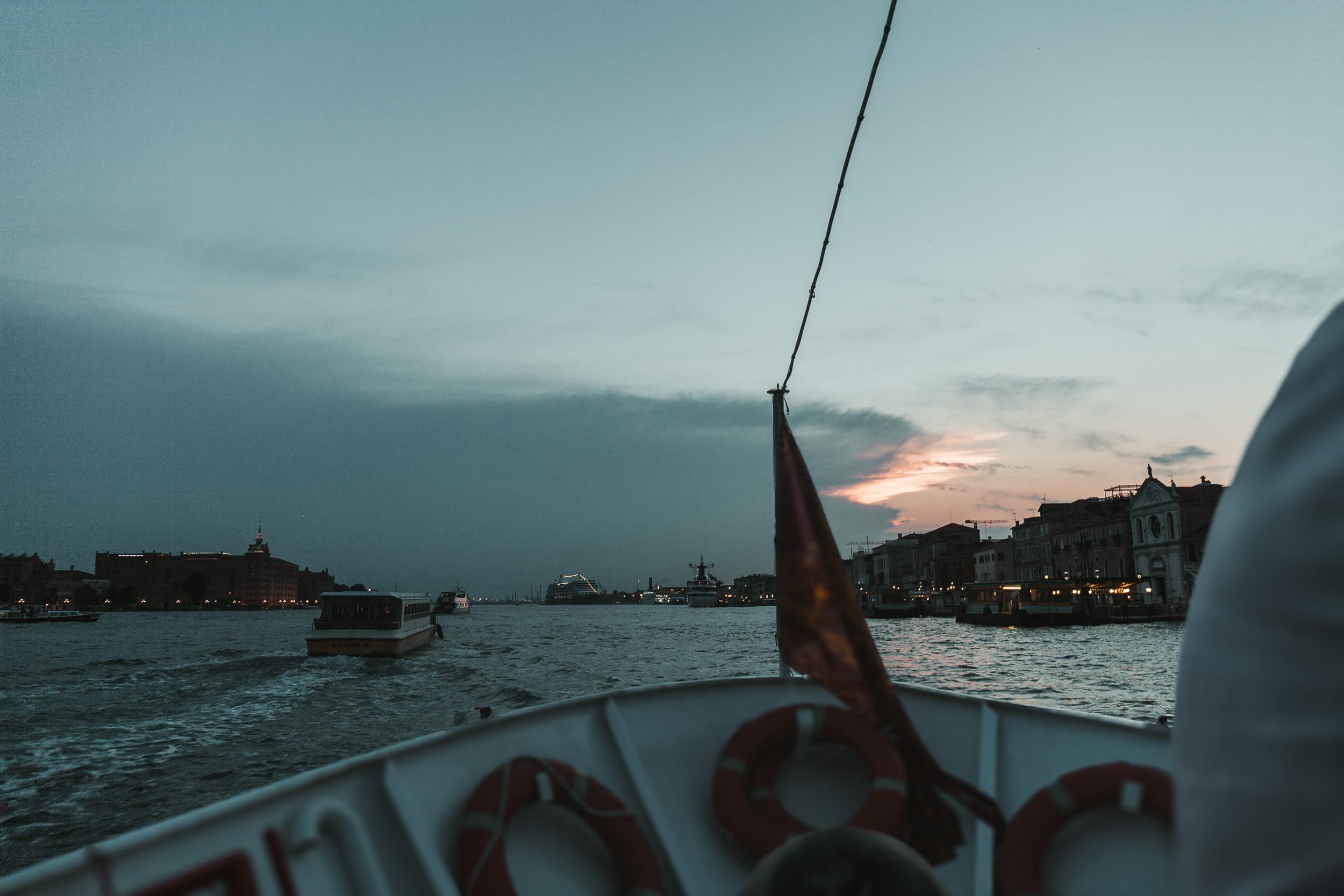Sunset over Venice Italy seen from a boat.