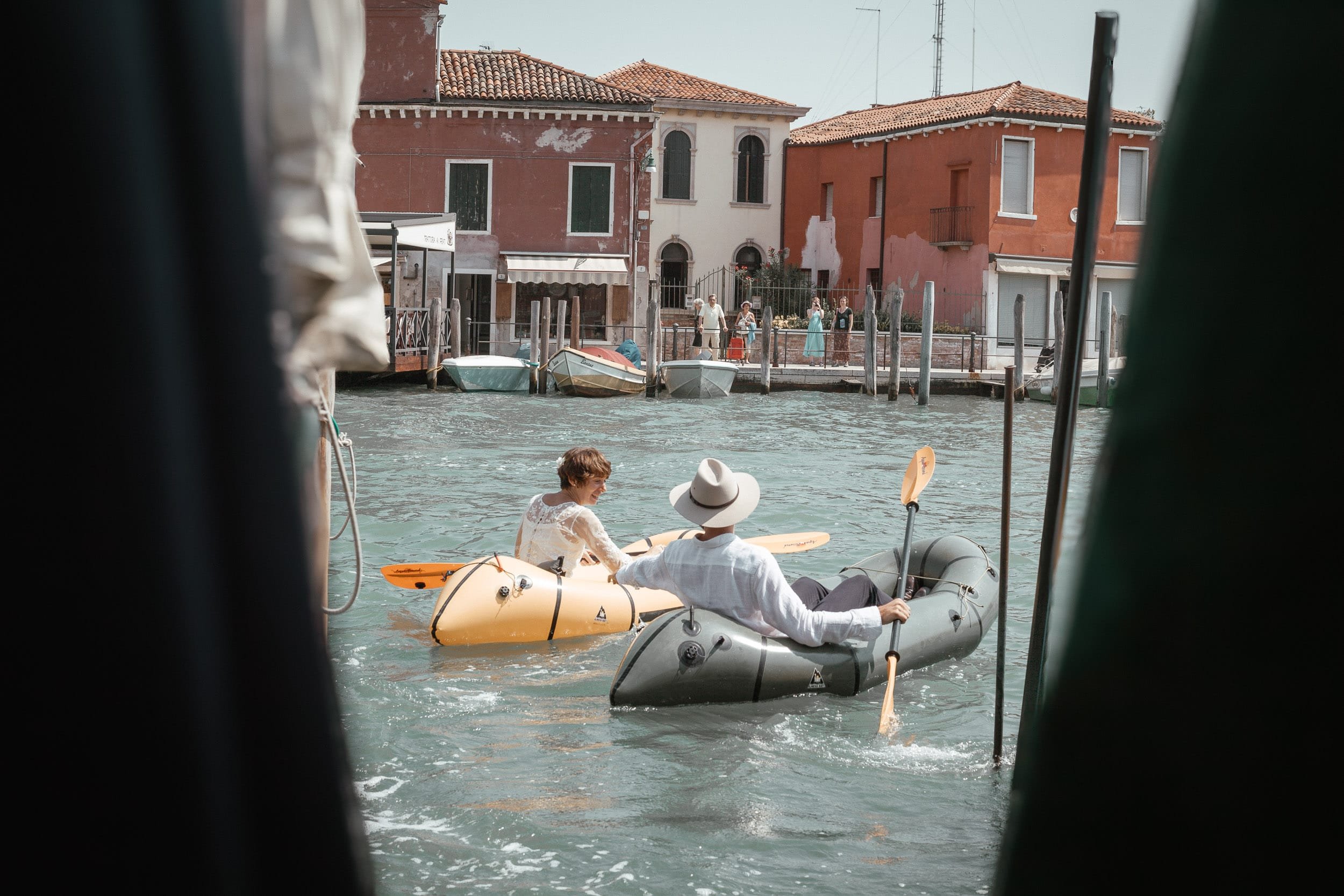 Newlyweds canoing in Venice Italy.