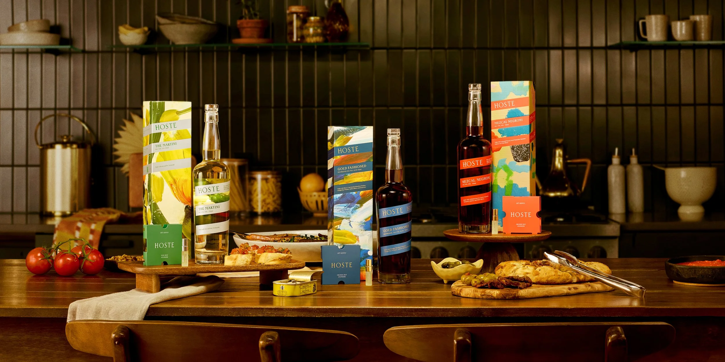 Colorful packaged food and beverage products styled on a warm-toned surface for a vibrant brand flat lay