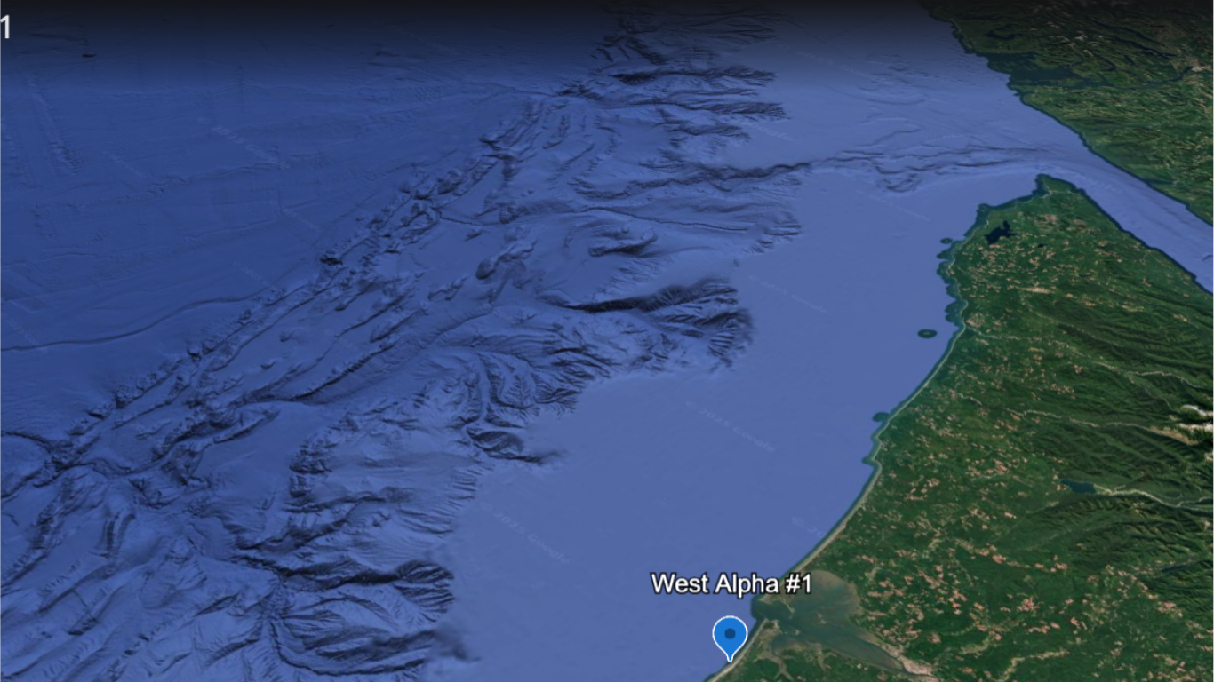 Map showing a section of the coastline with labeled location 'West Alpha #1' near the water and green terrain to the east, with a mountainous or hilly landscape.