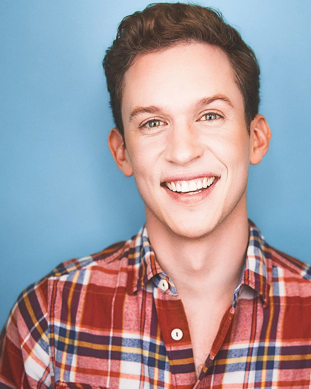 Daniel Fredrick headshot smiling into the camera