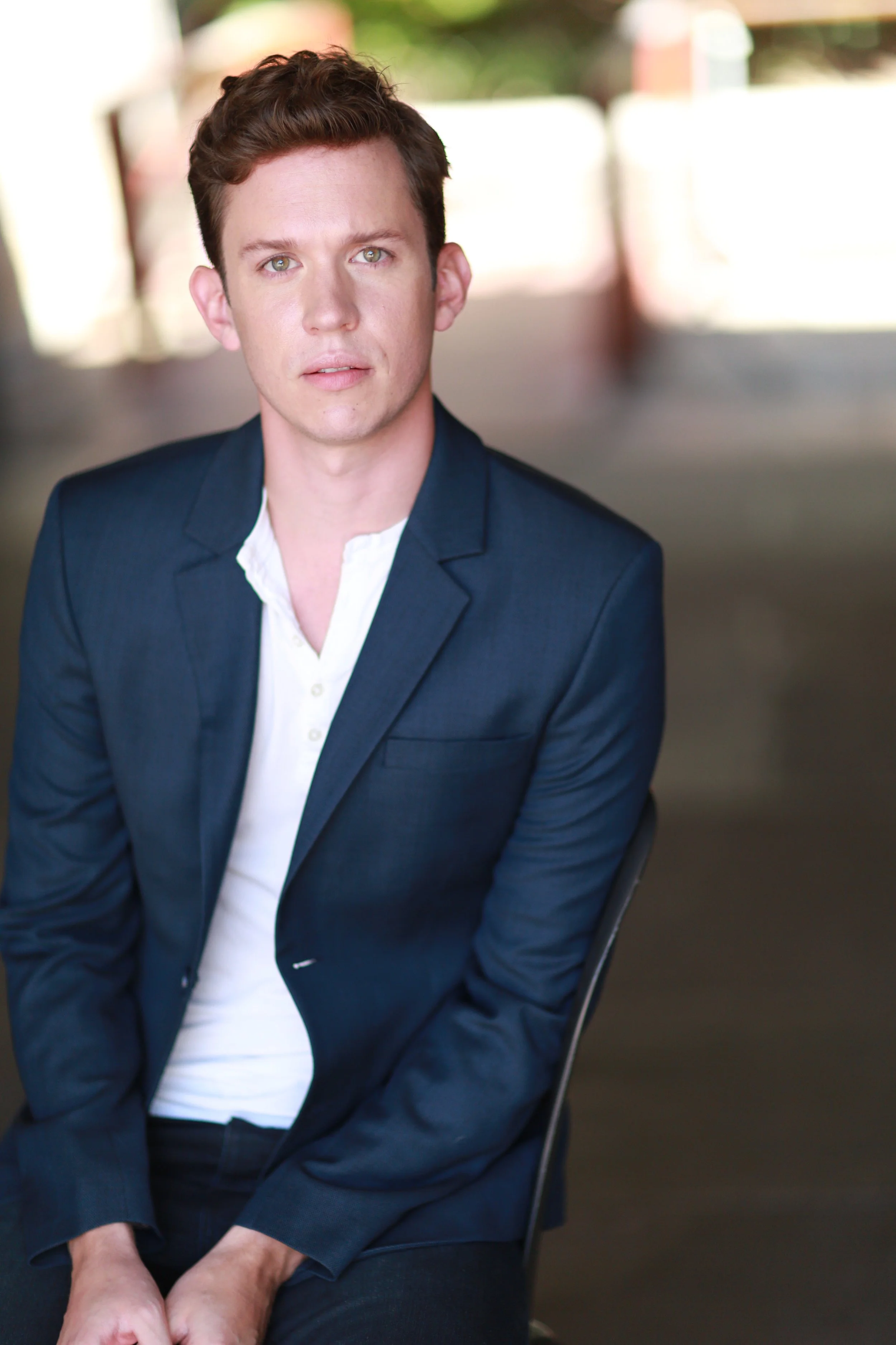 Daniel Fredrick headshot wearing a navy blue suit